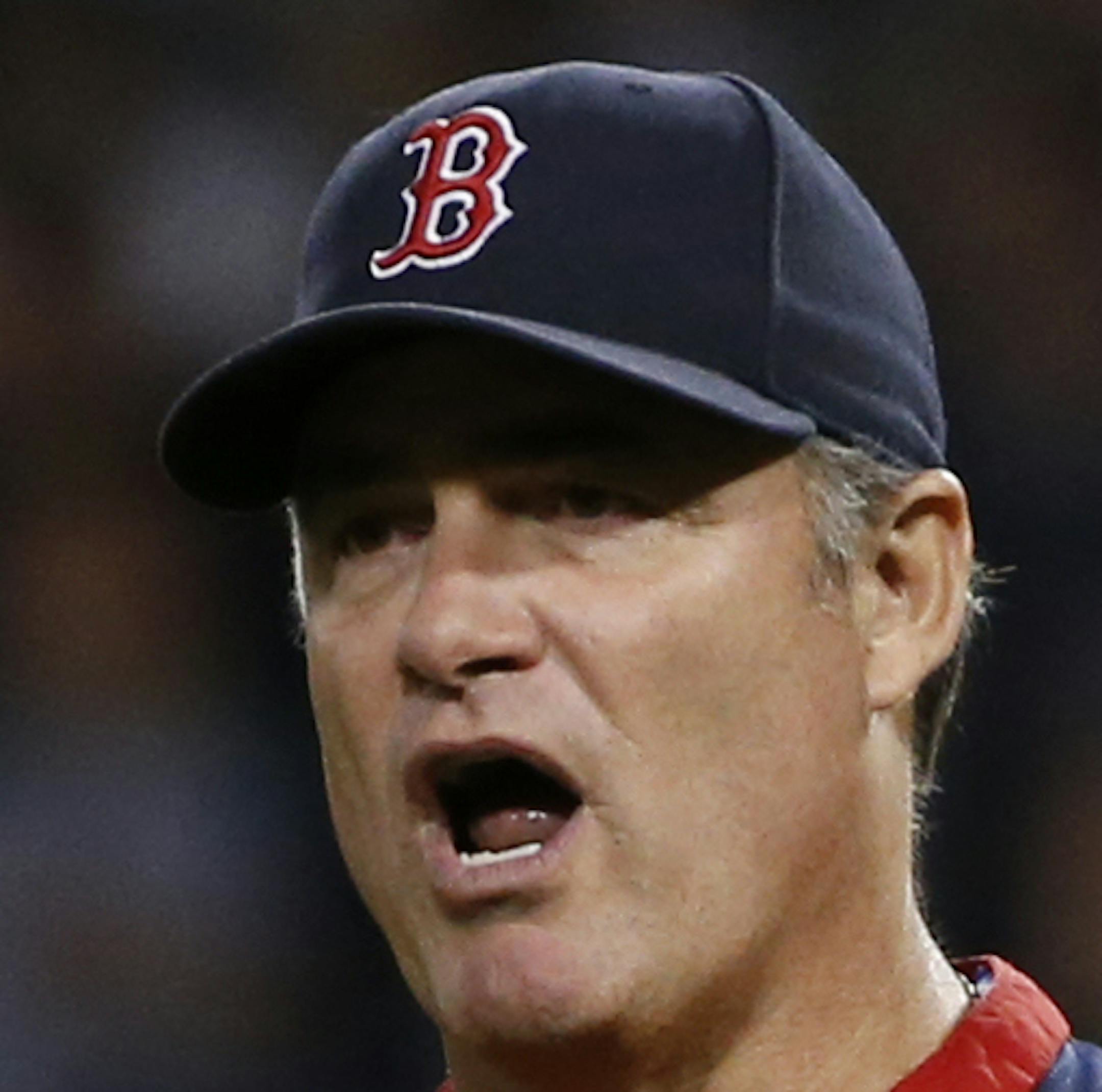 Boston Red Sox manager John Farrell calls for a replay review in the sixth inning of a baseball game against the Toronto Blue Jays at Fenway Park in Boston, Tuesday, May 20, 2014. The call on the field was overturned, and a home run was awarded to Red Sox' Jonny Gomes. (AP Photo/Elise Amendola)