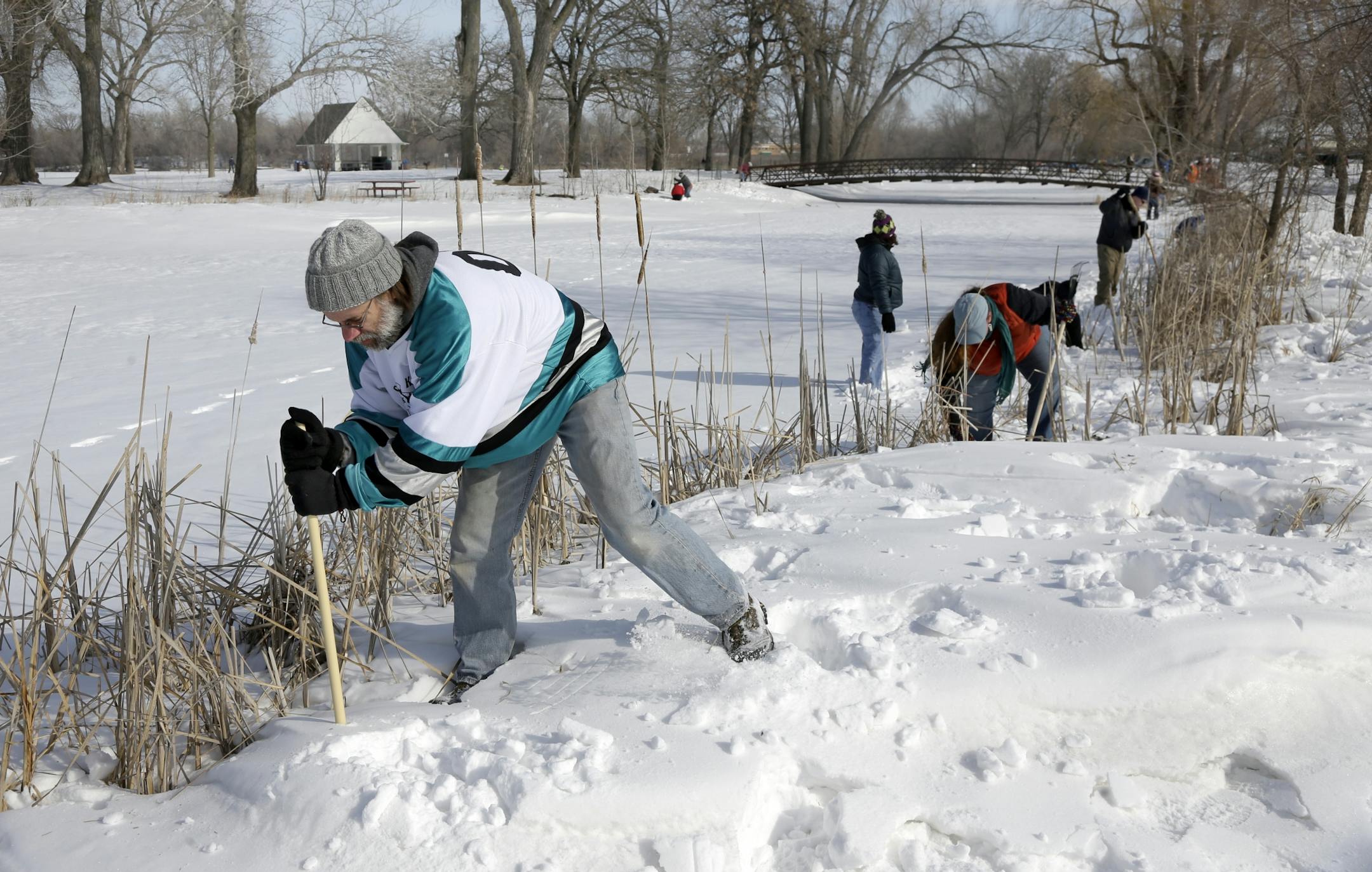 Bret Running and Natasha Jenson searched the lakes edge along with about 75 other volunteers who came to the call of Kira Trevino's family to search the Keller Lake area, Maplewood, MN., Saturday morning. The search was one of five conducted on March 23rd after items determined to be connected to Kira, through DNA tests, were found in the area last week . [ TOM WALLACE/STAR TRIBUNE Assignments #20028251B March 23, 2013 SLUG TREVINO0324 EXTRA INFORMATION Thirty-year-old Kira Trevino has been miss