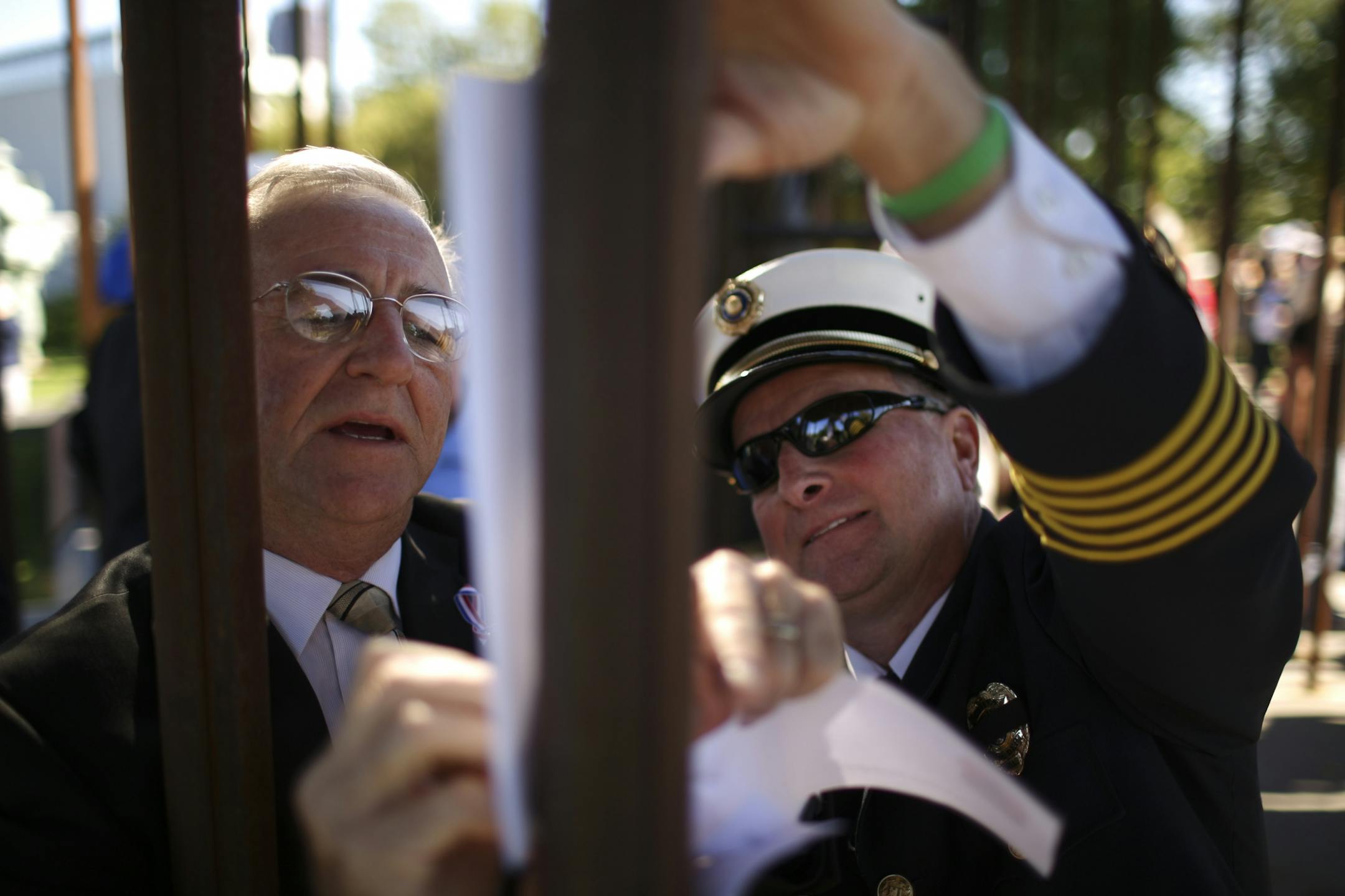Hundreds of people attended the Minnesota Fallen Firefighter Memorial Ceremony at the monument near the State Capitol Sunday afternoon, September 29, 2013 in St. Paul. With help from Maplewood Fire Chief Steve Lukin, Todd Klaenhammer made a rubbing of his father, Robert's, name after the ceremony concluded. Robert Klaenhammer, the Maplewood Fire Marshal and a member of the Gladstone Fire Department, died in a car crash in 1967 while responding to a fire alarm. His death while in service was disc