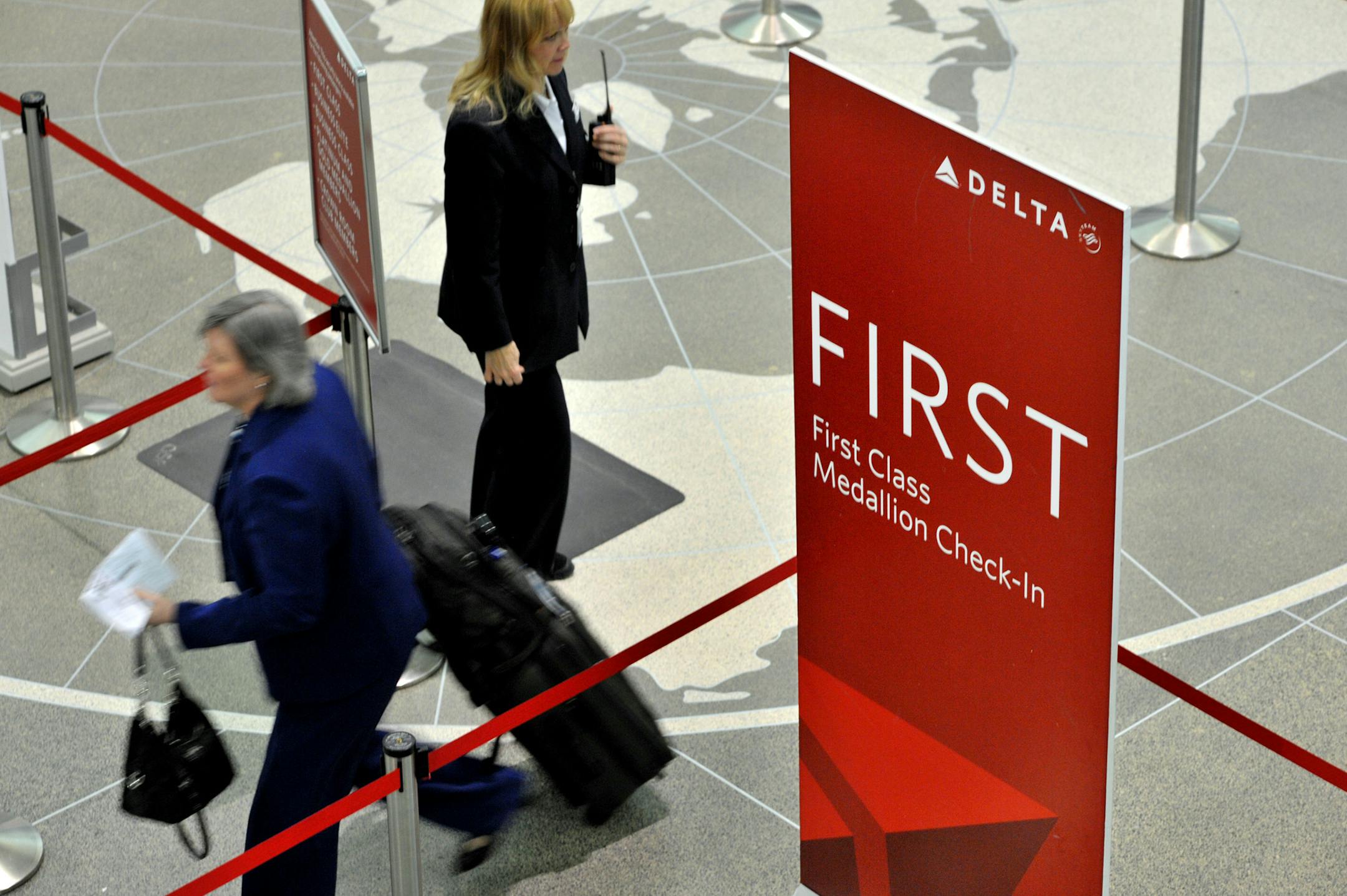 GLEN STUBBE &#x2022; gstubbe@startribune.com -- Monday, March 29, 2010 -- Bloomington, Minn. -- ] Delta Airlines has changed how it upgrades passengers to first class. This is the first class and medallion check-in at Minneapolis St. Paul International Airport.