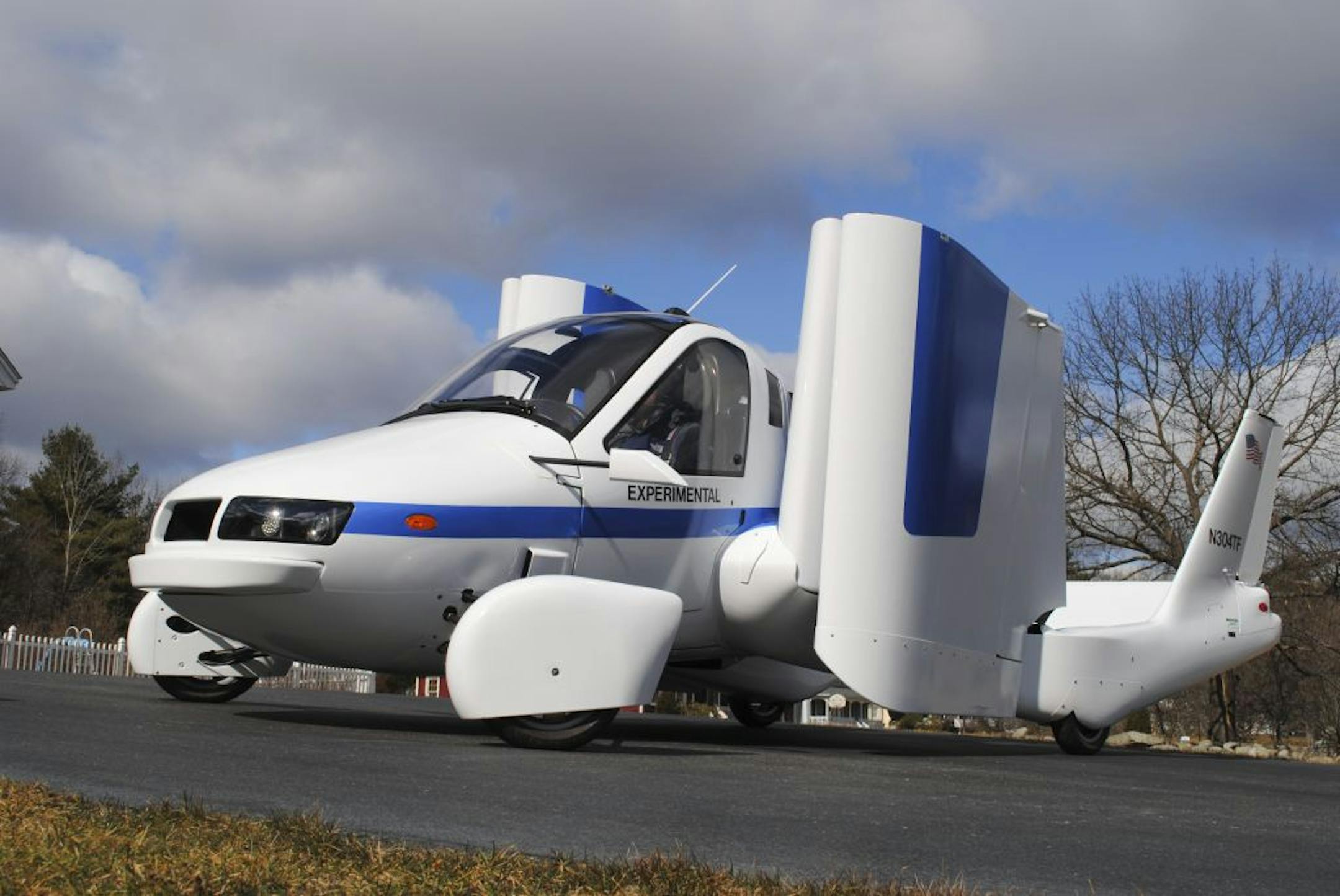 Terrafugia's prototype flying car, with two seats, four wheels and wings that fold up so it can be driven like a car, flew at 1,400 feet for eight minutes during the test.