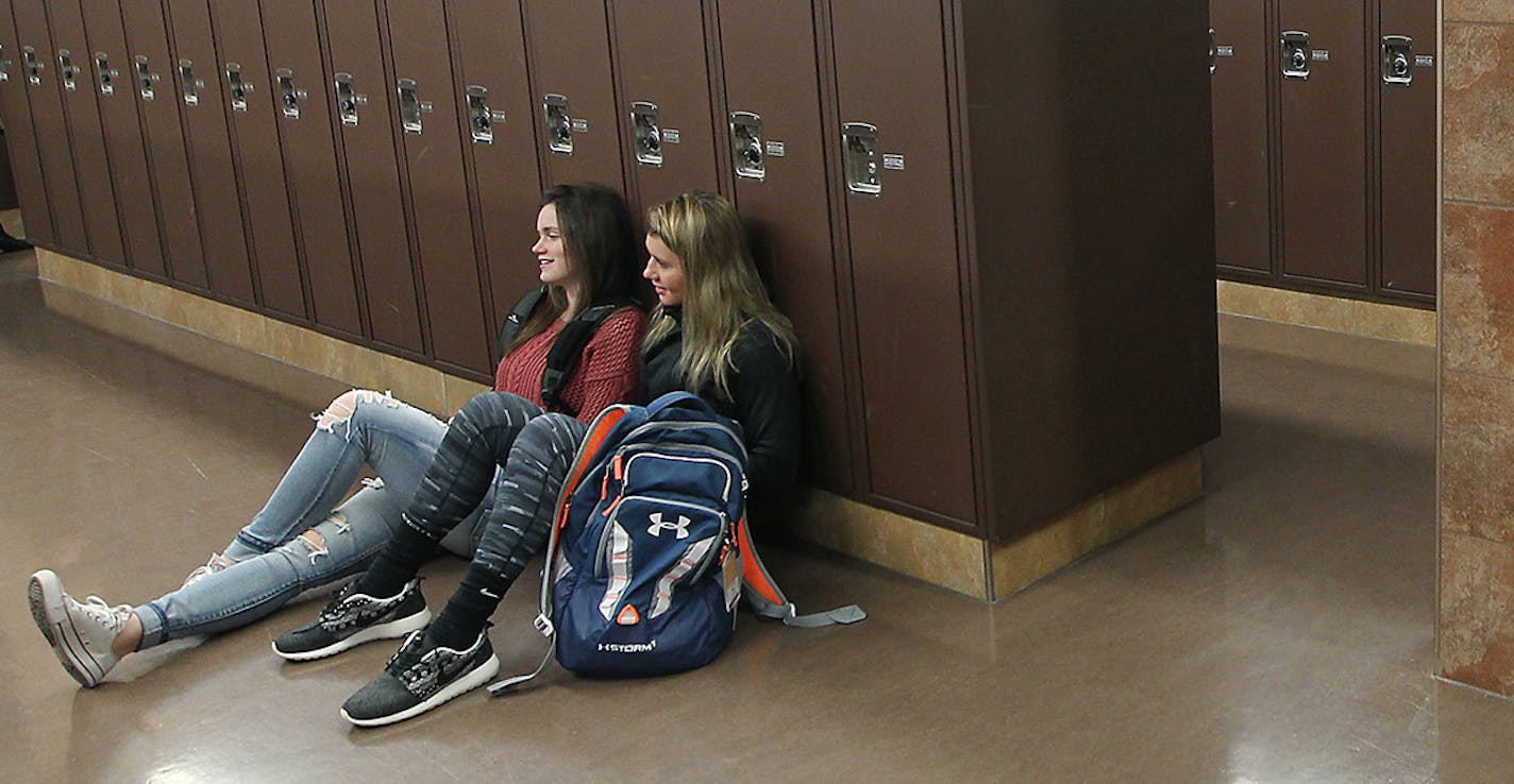 Chanhassen High School seniors gathered around their lockers waiting for school to begin, Thursday, January 21, 2016 in Chanhassen, MN. Some students at high schools including Edina, Wayzata and Stillwater have stopped using lockers altogether, choosing to keep bookbags under their desks and coats in their cars. Principals assert that they're designing high schools with new common spaces in mind for student gathering spots. ] (ELIZABETH FLORES/STAR TRIBUNE) ELIZABETH FLORES &#x2022; eflores@star