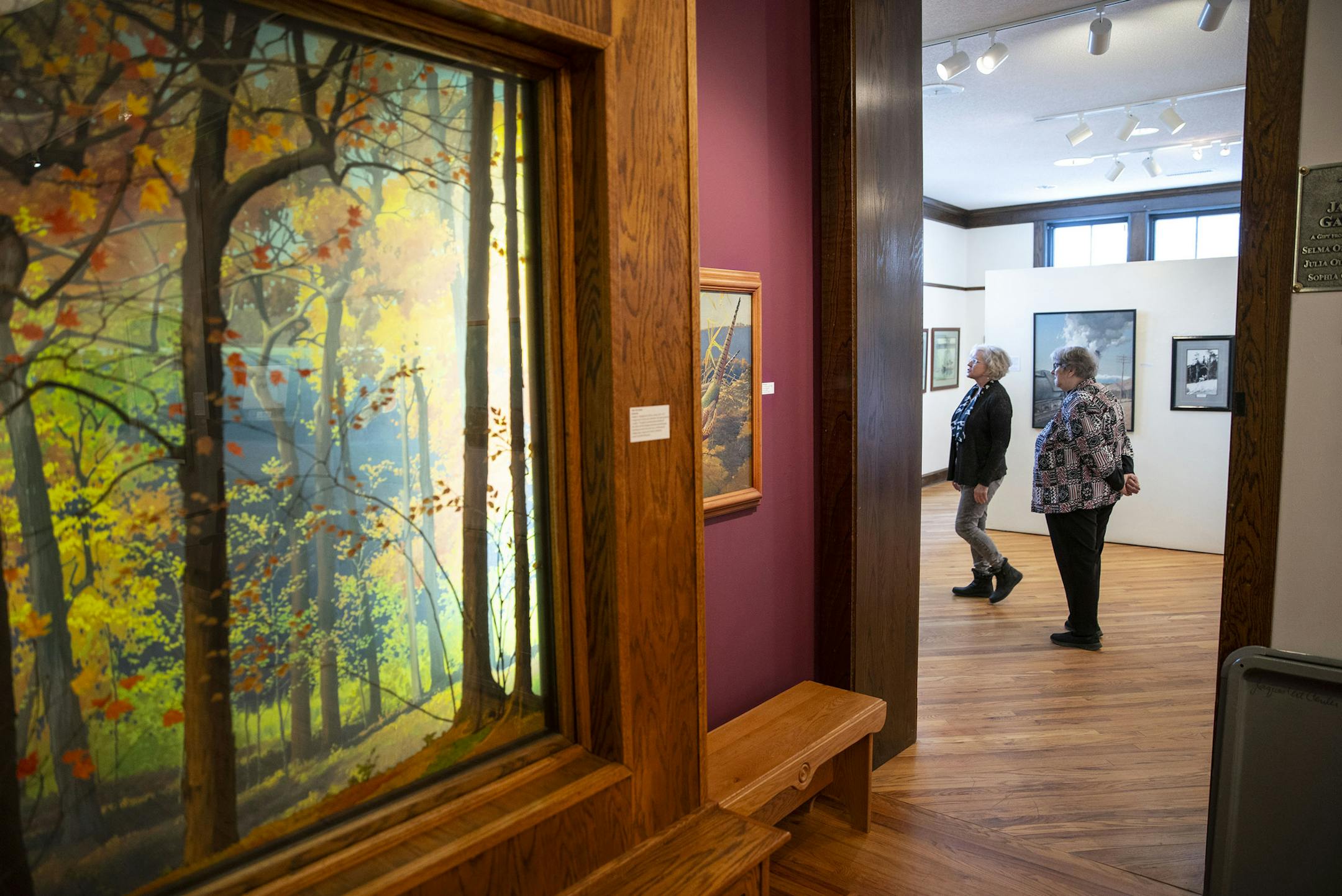Pamela Andell, executive director of the Jaques Art Center, and board vice president Jan Hasselius toured a 25th anniversary exhibit devoted to its namesake, Francis Lee Jaques.