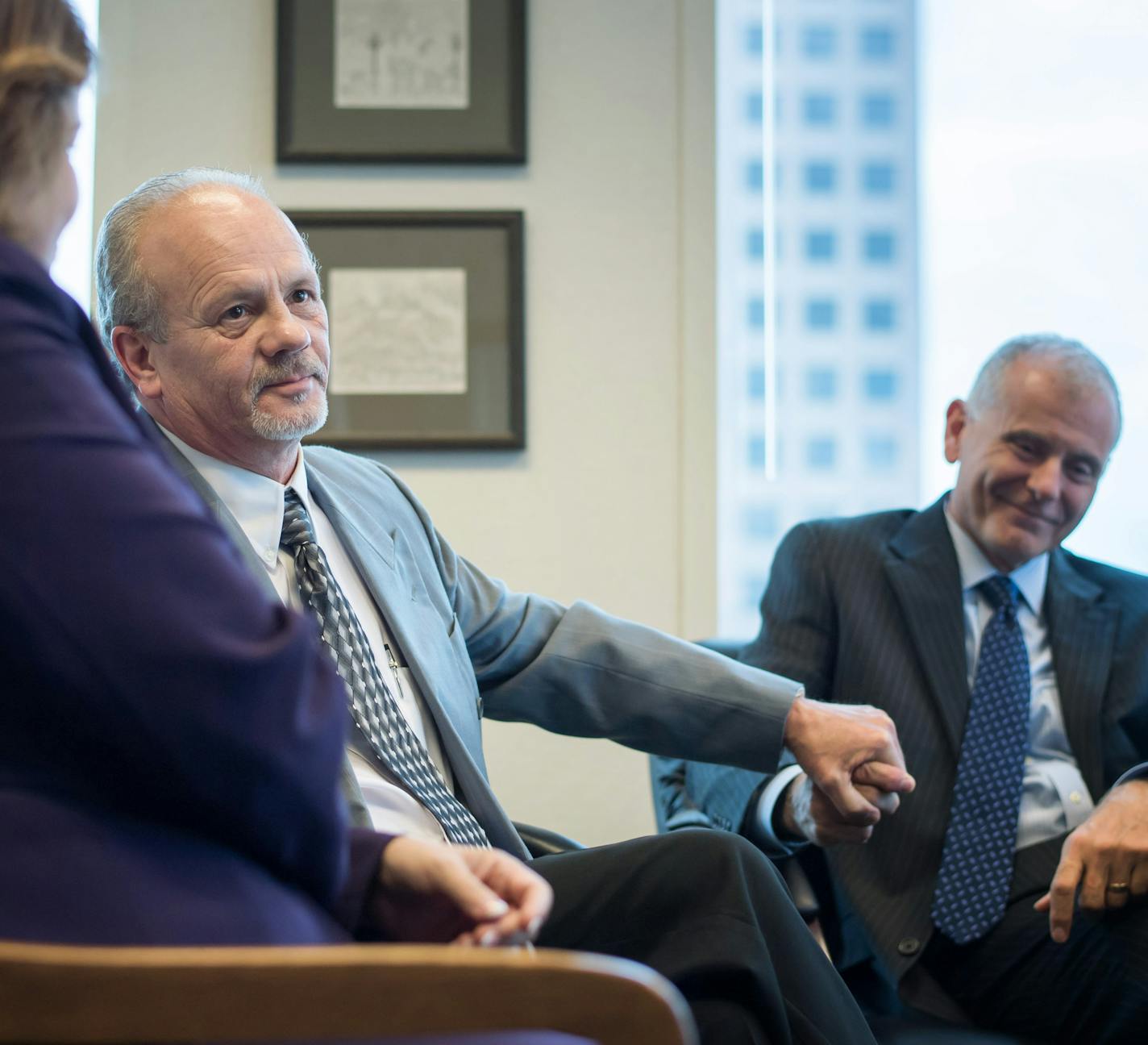 Terry Lynn Olson thanked his lawyers, Julie Jonas, legal director of the Innocence Project in Minnesota, left and David Schultz, right. ] GLEN STUBBE * gstubbe@startribune.com Friday, September 16, 2016 News conference for Terry Lynn Olson, a Minnesota man who spent 11 years in prison for a murder he didn't commit before he was freed this week.