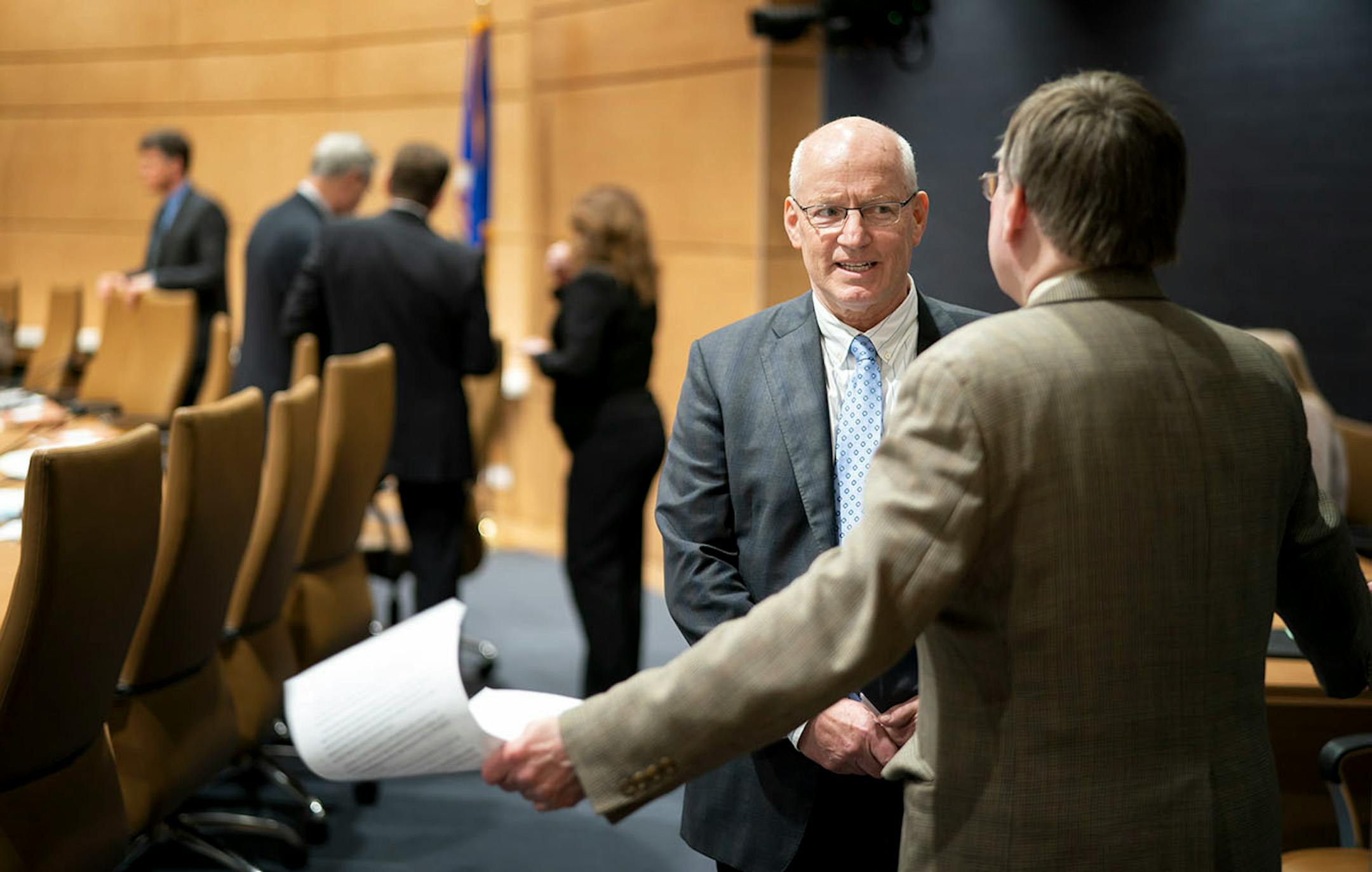 Commissioner Frans talked with Senator Richard Cohen before an evening hearing of the Senate Finance Committee.