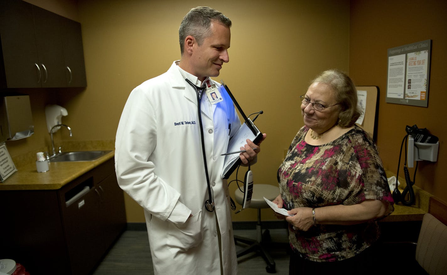 Dr. Brett Teten talked with patient Nawal Kamel during a checkup at HealthEast St. Paul clinic. The state is now ranking clinics on patient experience surveys and one of the top-performing clinics is HealthEast St. Paul. Wednesday, August 14, 2013 ] GLEN STUBBE * gstubbe@startribune.com