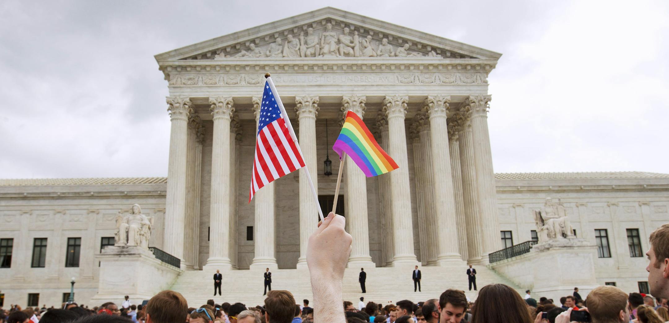 The crowd celebrates outside of the Supreme Court in Washington, Friday June 26, 2015, after the court declared that same-sex couples have a right to marry anywhere in the US. (AP Photo/Jacquelyn Martin) ORG XMIT: MIN2015062611544144