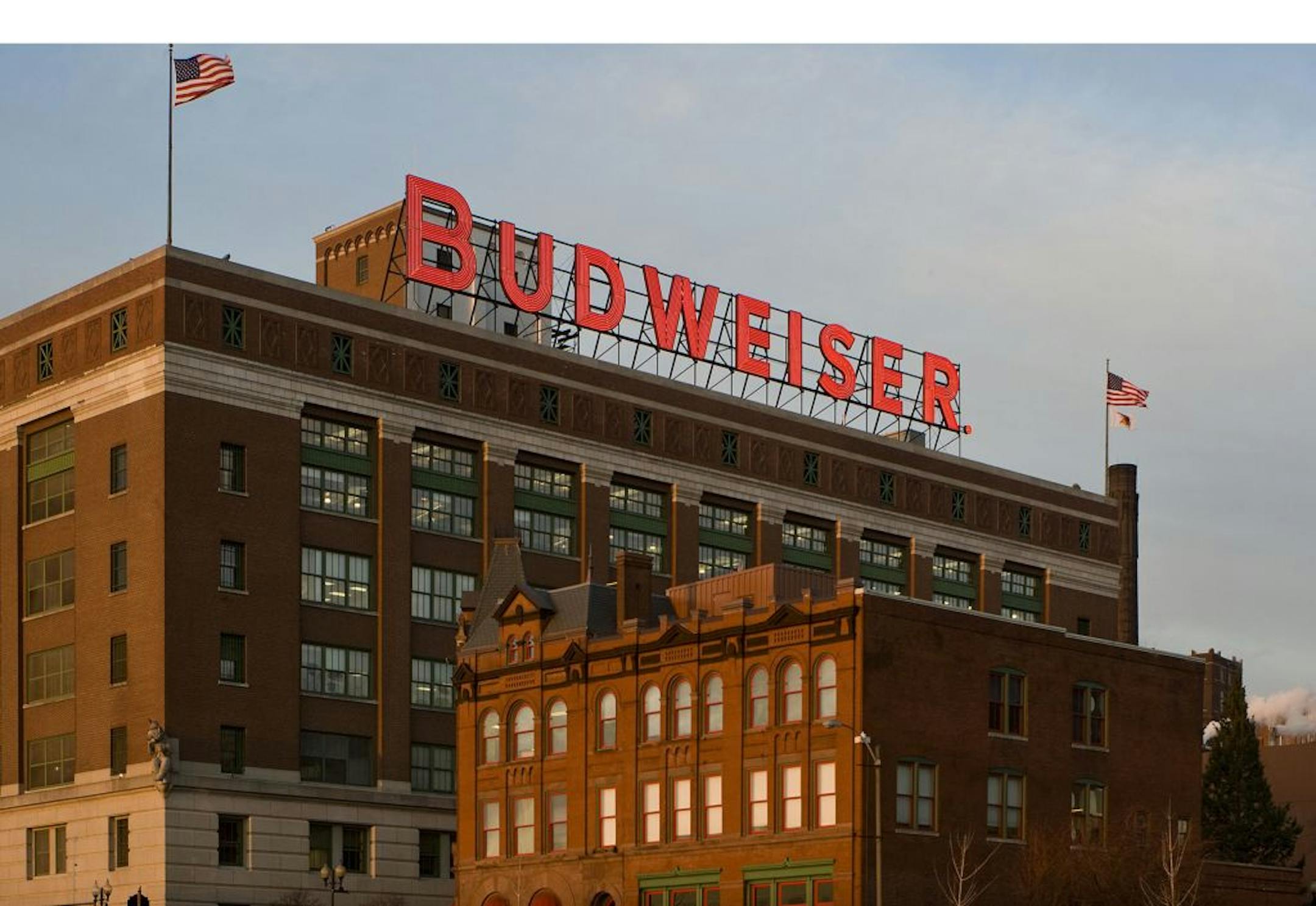 Anheuser-Busch InBev, based in St. Louis, said it would "vigorously" fight the lawsuit by the Justice Department.