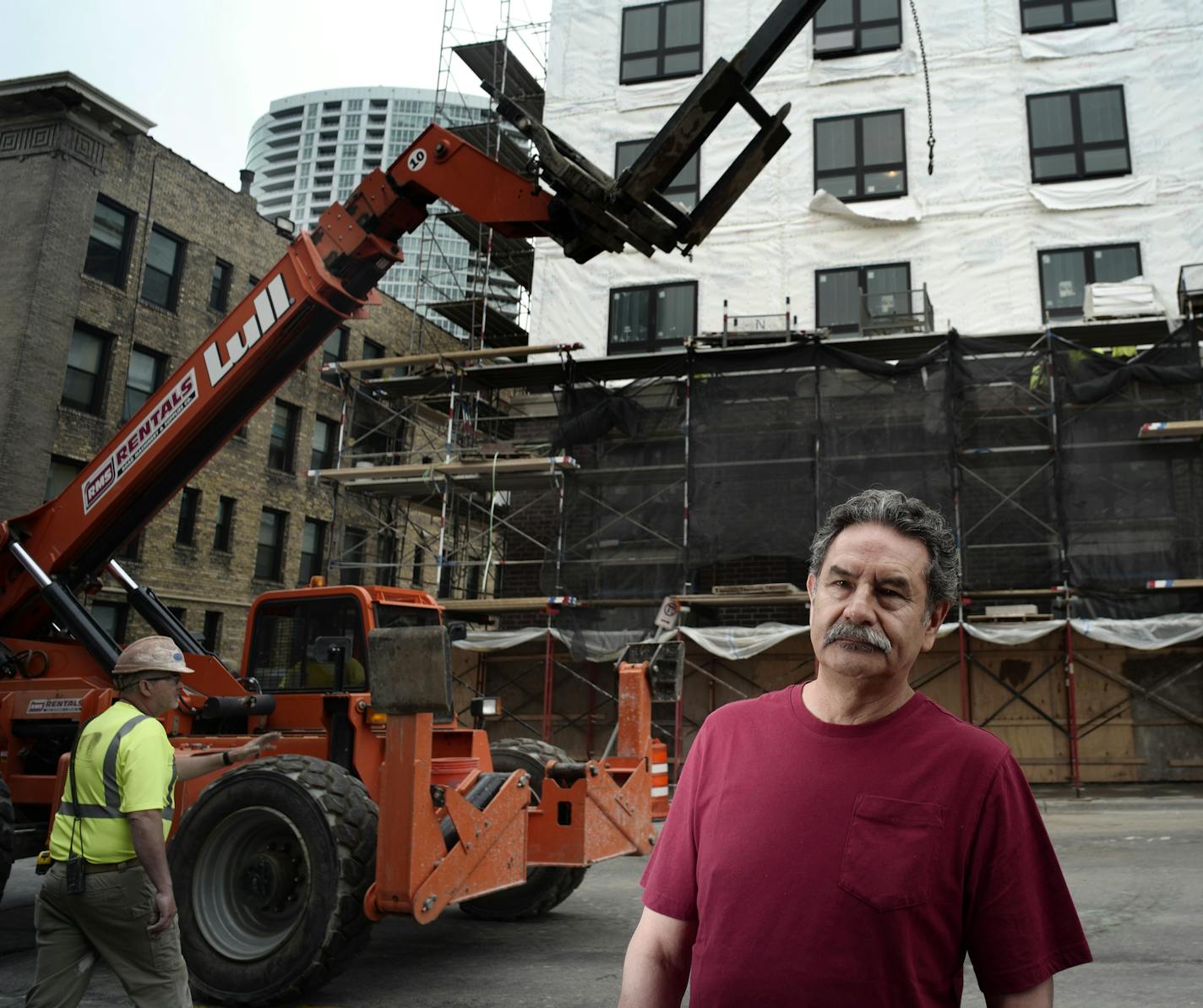 Lorenzo Ariza is the owner of Salsa a la Salsa, a restaurant that will be displaced by a new apartment building on Nicollet Avenue, in the background. ]A new apartment building in Loring Park will displace a handful of high-profile businesses and the development is sharpening concern over gentrification in the decreasingly scruffy pocket of downtown Minneapolis.Richard Tsong-Taatarii&#xef;rtsong-taatarii@startribune.com