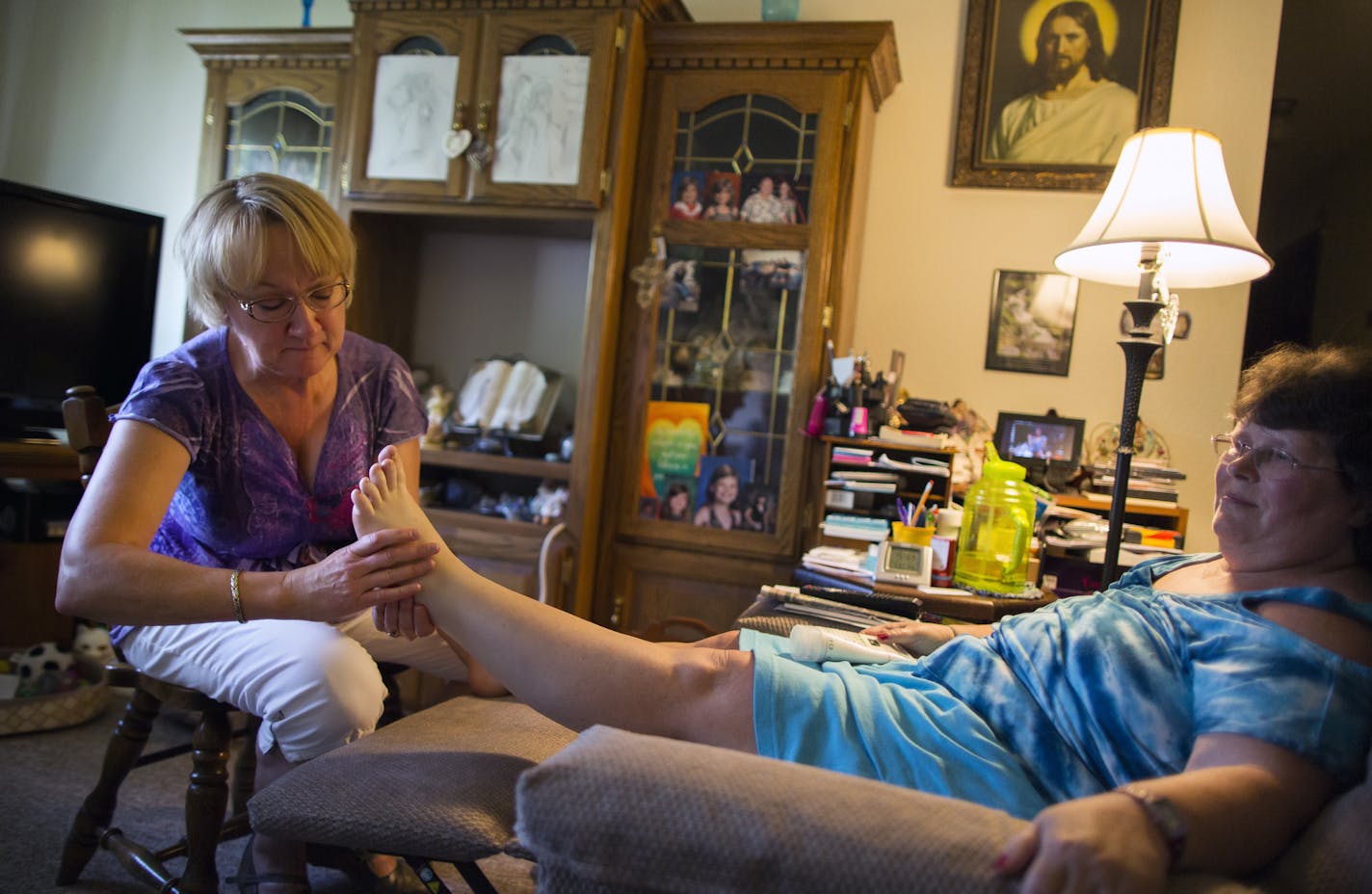 PCA Sadie Hawkins (left) works with Patty Swanson at her apartment in Forest Lake. ] The years-long battle to unionize home health care workers culminates July 1 when 27,000 employees will be under a new contract that will offer a $9 per hour floor, rising to $11 per hour and, for the first time ever, paid time off. Brian.Peterson@startribune.com Forest Lake, MN - 6/29/2015