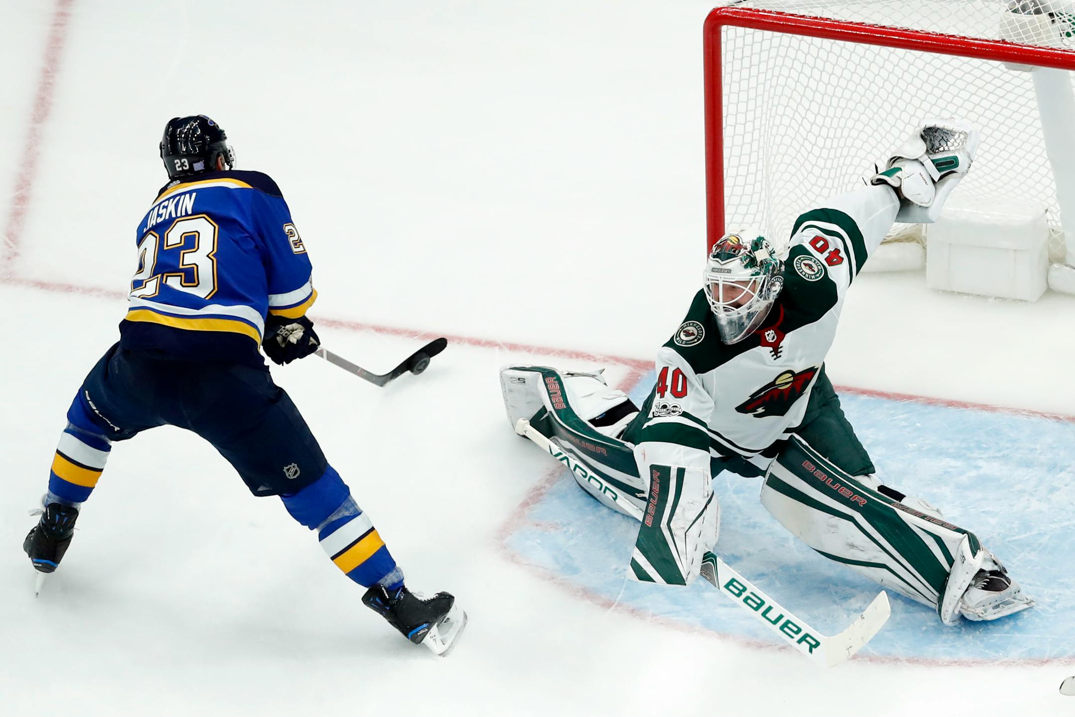 St. Louis Blues' Dmitrij Jaskin, of Russia, scores past Minnesota Wild goalie Devan Dubnyk, right, during the first period of an NHL hockey game Saturday, Nov. 25, 2017, in St. Louis. (AP Photo/Jeff Roberson)