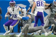 Minnesota Vikings wide receiver Justin Jefferson (18) was tackled in the back field for a 9 yard loss by Detroit Lions defensive end Levi Onwuzurike (