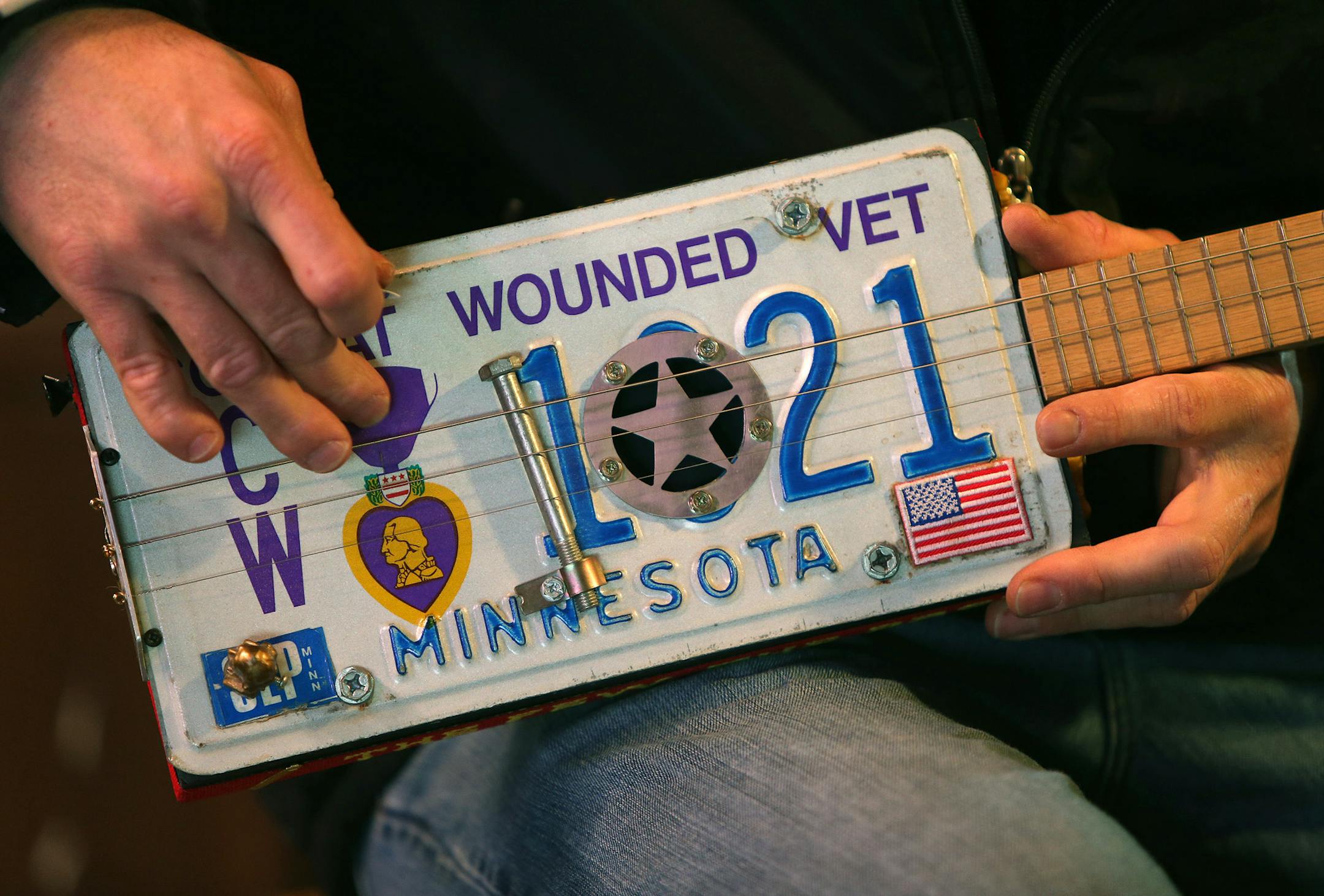 Roger Wold worked on a guitar from his garage, Monday, December 16, 2013 in Anoka, MN. (ELIZABETH FLORES/STAR TRIBUNE) ELIZABETH FLORES • eflores@startribune.com