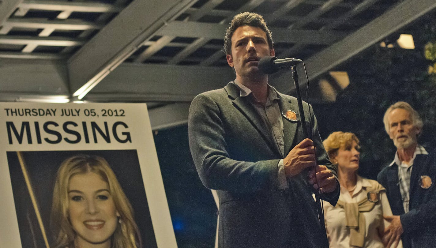 This image released by 20th Century Fox shows, from left, Ben Affleck, Lisa Barnes and David Clennon in a scene from "Gone Girl." The film, based on the best-selling novel, will release on Oct. 3. (AP Photo/20th Century Fox, Merrick Morton)