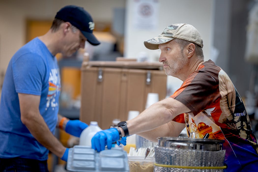 Richard Bahr, right, leads a ministry that serves meals to homeless people every morning at the Salvation Army Harbor Light Center. “I have a heart for those that most people have given up on,” he said.