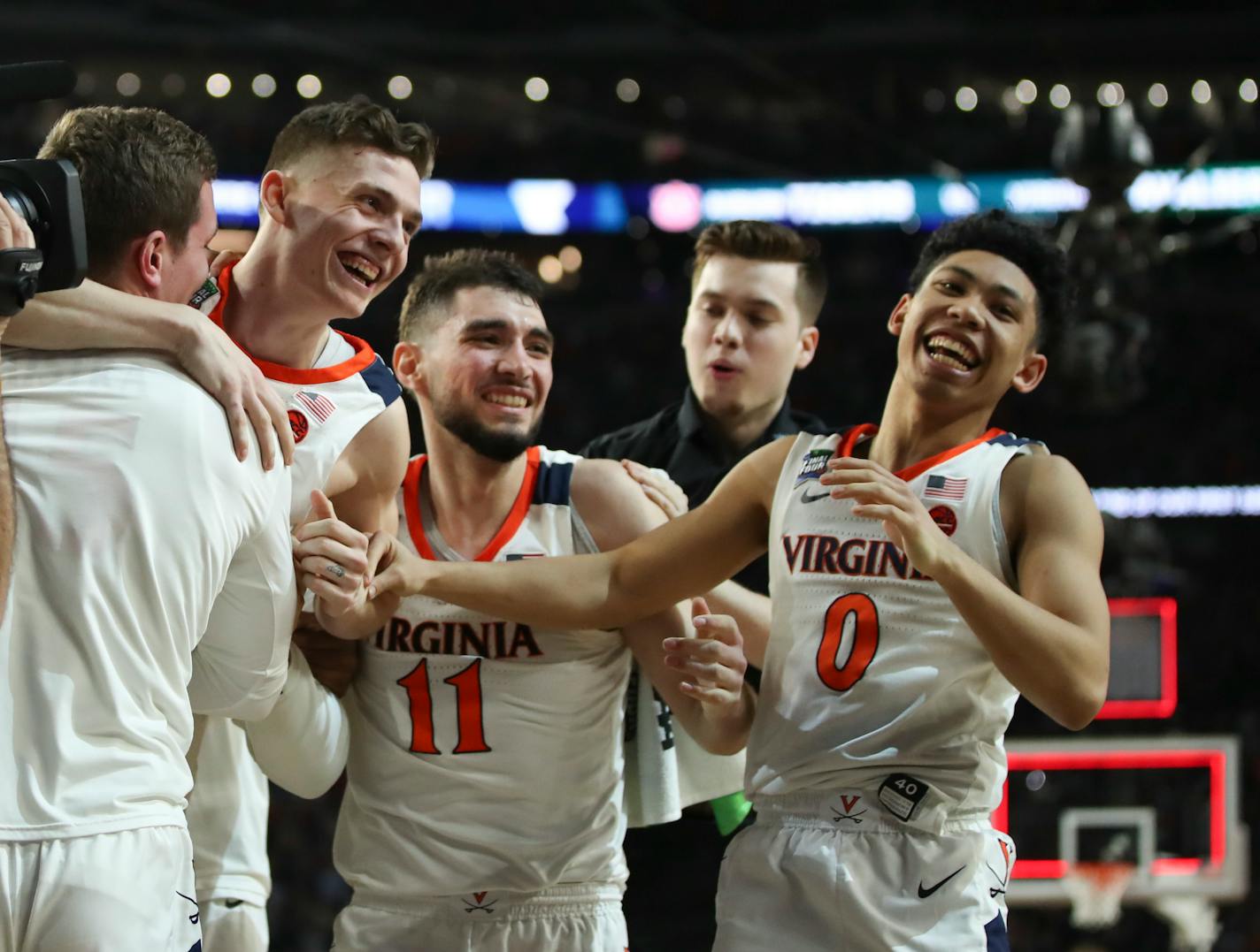 Virginia teammates celebrated with Kyle Guy, second from left, after he made three free throws to win the game.