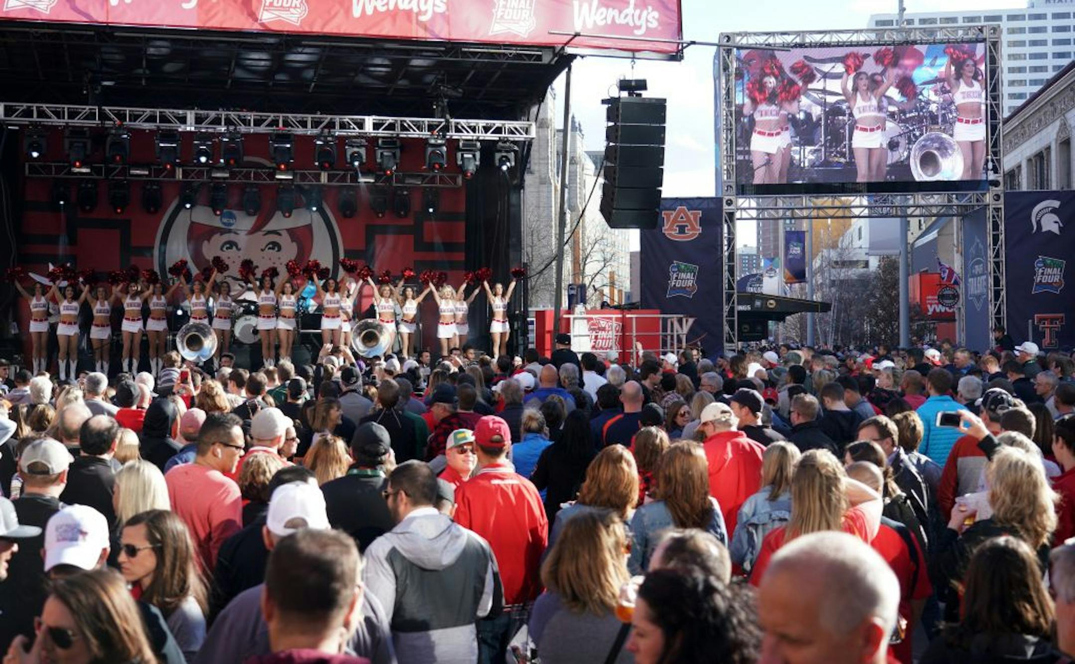 The Final Four Tip-Off Tailgate Party was well underway with a pep rally for Texas Tech (Cheerleaders on stage) and Virginia on Monday afternoon on the Nicollet Mall in downtown Minneapolis.