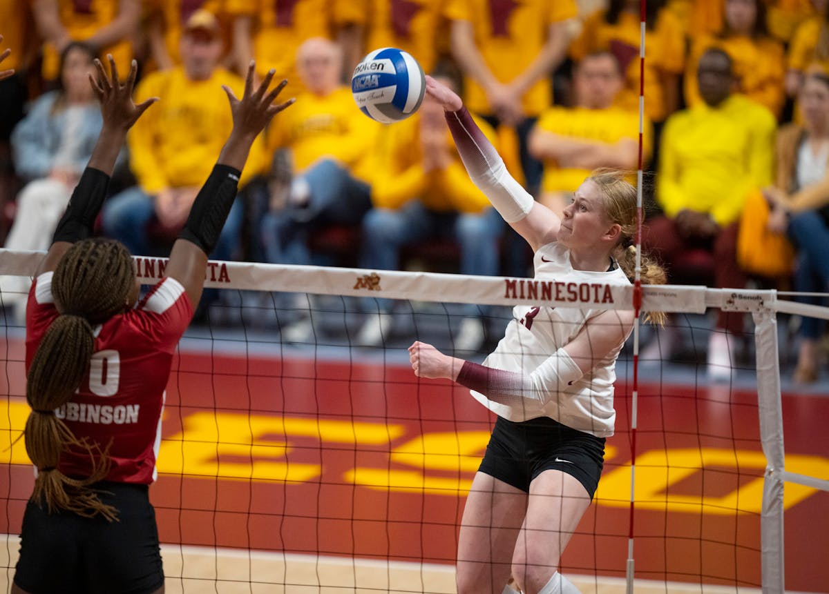 Minnesota’s McKenna Wucherer, hitting a shot against Wisconsin on Sunday, has become one of the teams kill leaders since recovering from an injury. 