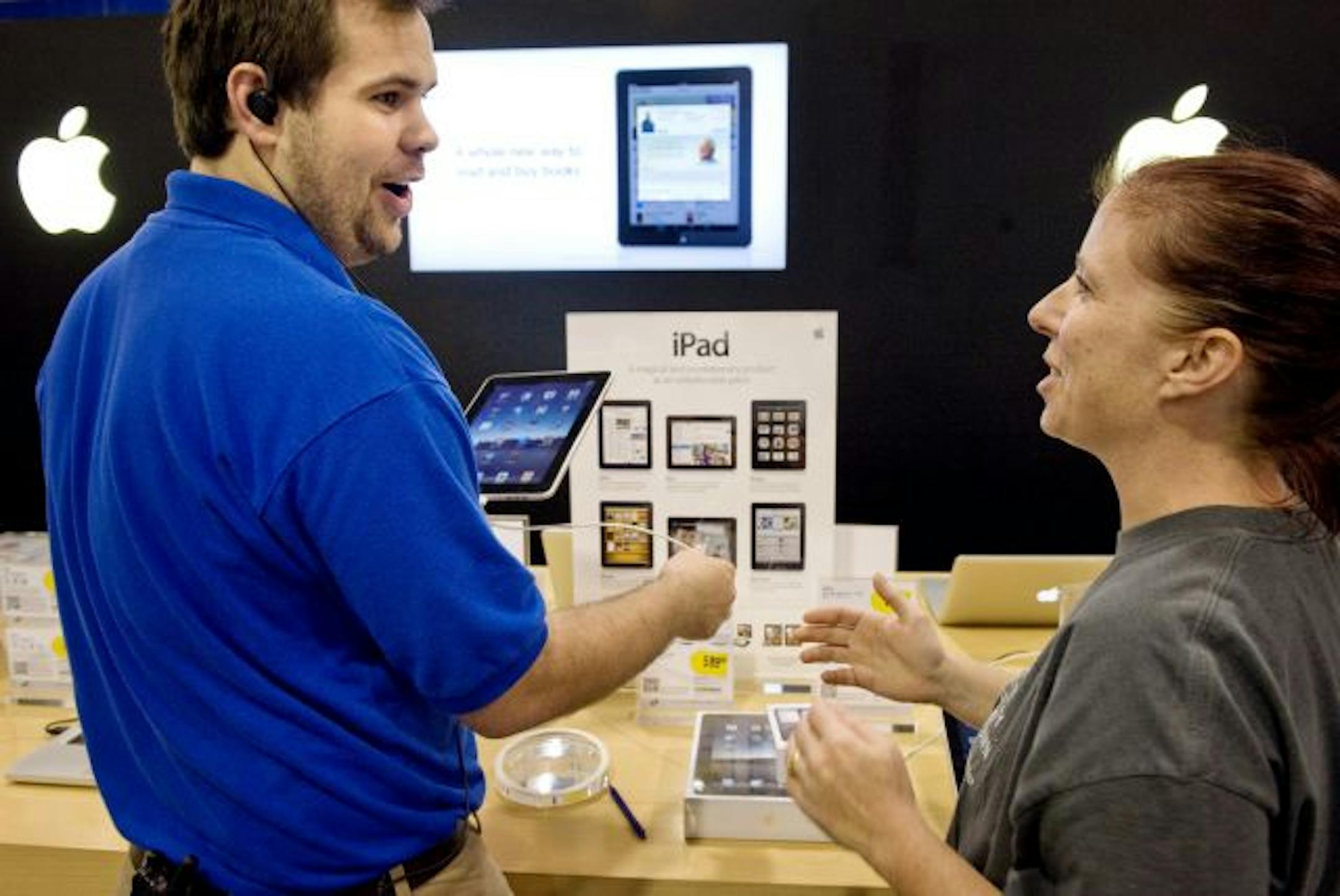 Best Buy hopes moving workers to the sales floor will help focus on selling customers more merchandise. Here, John Haupert helped Tanya Matheys purchase an iPad and iPod at a Best Buy in Eagan in 2010.