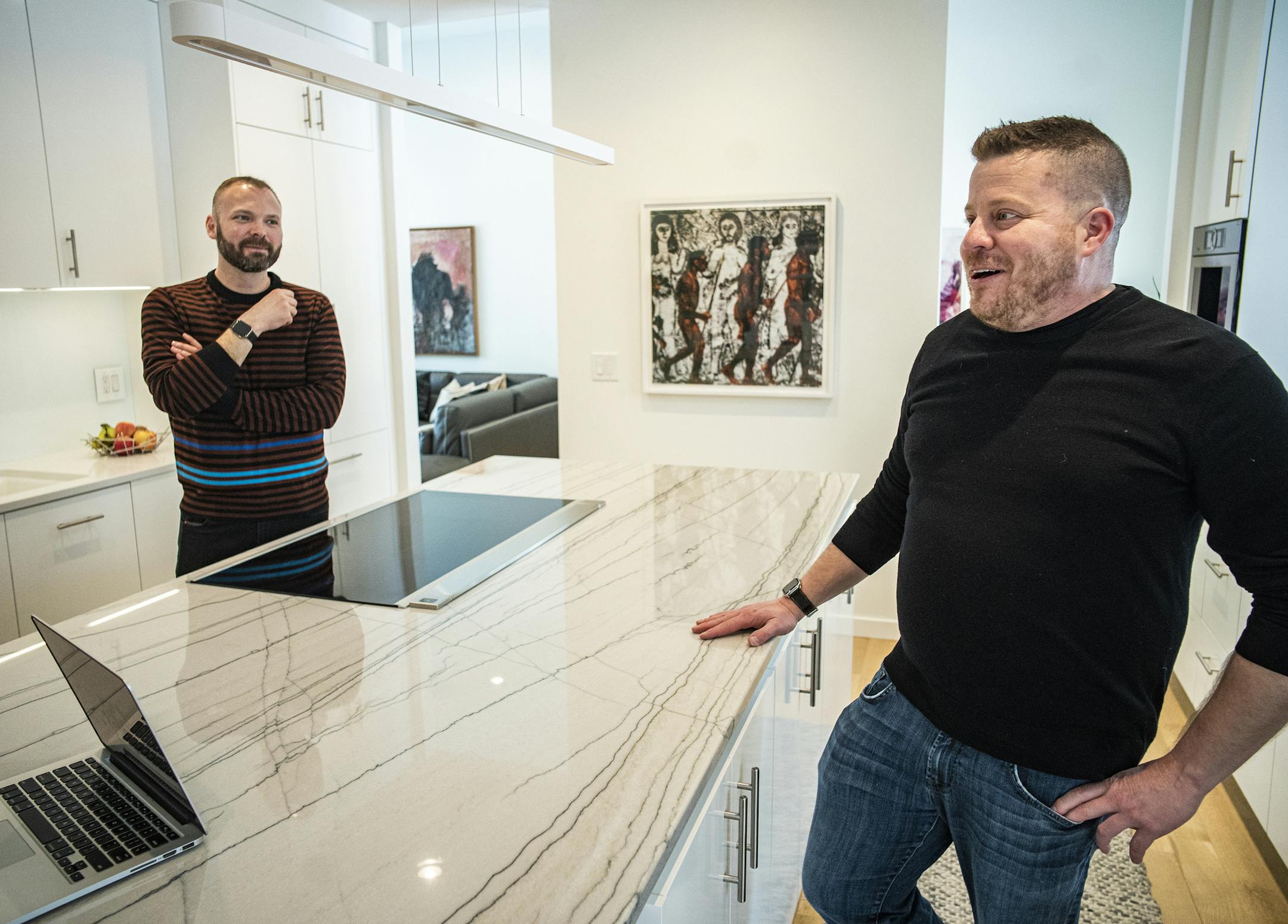Bryan Kramer, left, and Trent Eisenberg bought Eisenberg's father's house in Plymouth, where Eisenberg lived as a teen, and remodeled it to give it the aesthetic of a modern condo.