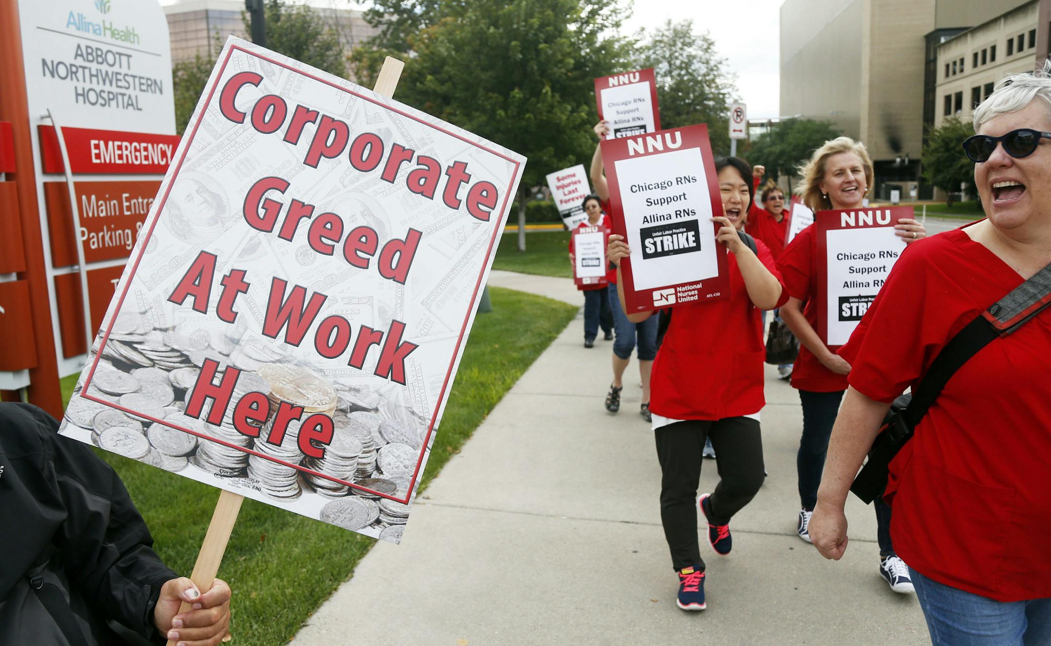 Allina Health nurses protest outside Abbott Northwestern Hospital in Minneapolis on Monday, Sept. 5, 2016 as they began an open-ended strike after a failure to reach a settlement with Allina Health. Nurses are walking picket lines at five Minnesota hospitals in a strike over health insurance, workplace safety and staffing. (AP Photo/Jim Mone) ORG XMIT: MIN2016090914083113