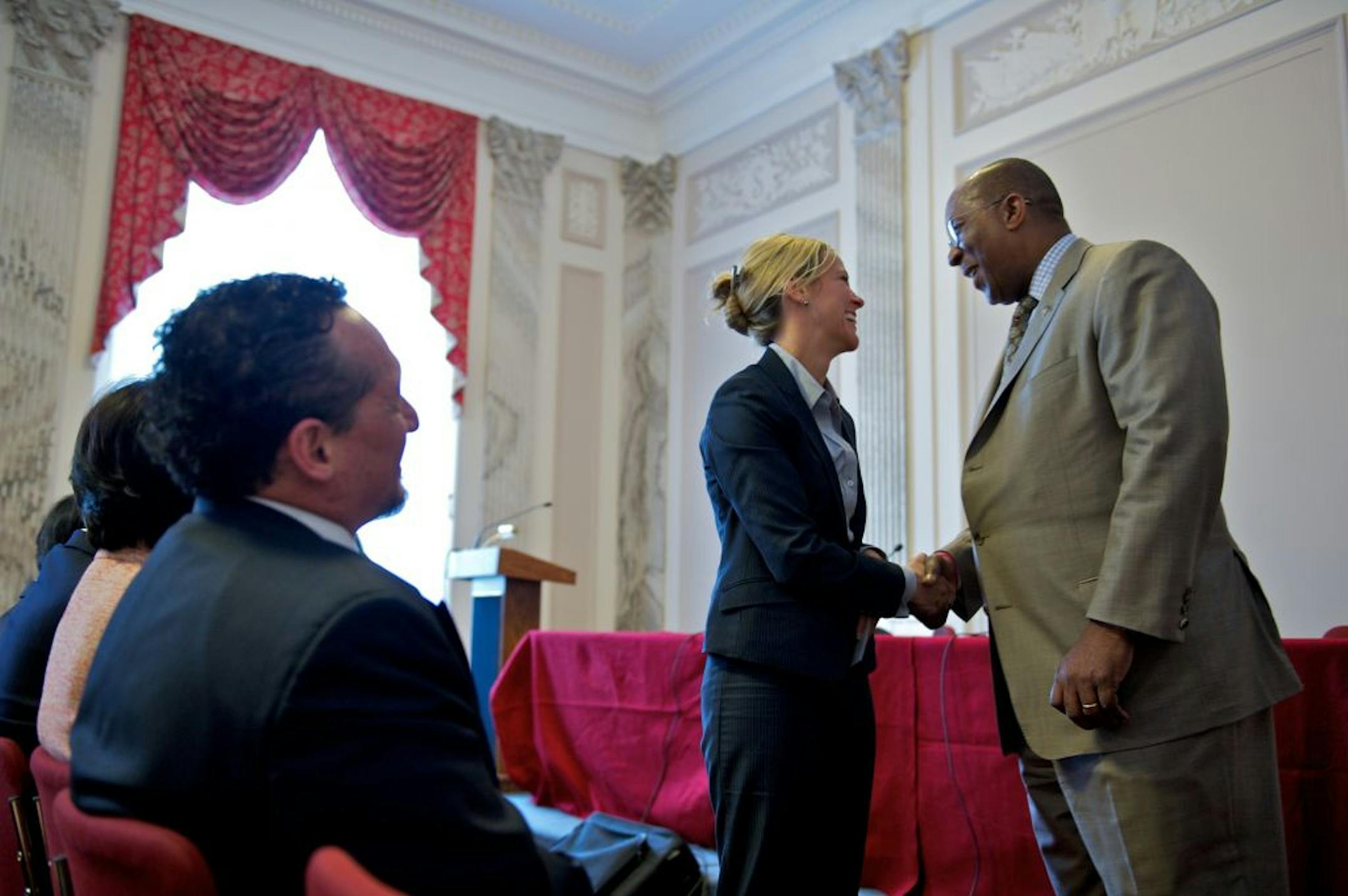 Cargill lobbyist Devry Boughner, talks to Ambassador Ron Kirk, United States Trade Representative who was on a panel to launch the U.S. Business Coalition for Trans-Pacific Partnership at a meeting in the Russell Senate Office Building on Capitol Hill in Washington, D.C., Wednesday, April 18, 2012.