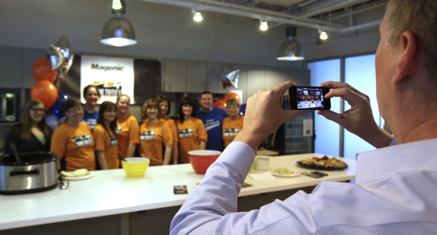 Magenic employee Jay Meekin took a photo of the voluteers after they served lunch at a fundraiser for "Time to Fly", a non profit for childrens cancer research in St. Louis Park, MN on May 30, 2013. ] JOELKOYAMA&#x201a;&#xc4;&#xa2;joel koyama@startribune.com