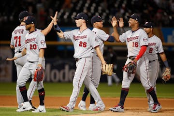 The Twins celebrate after beating the Chicago White Sox 10-3 on Thursday.