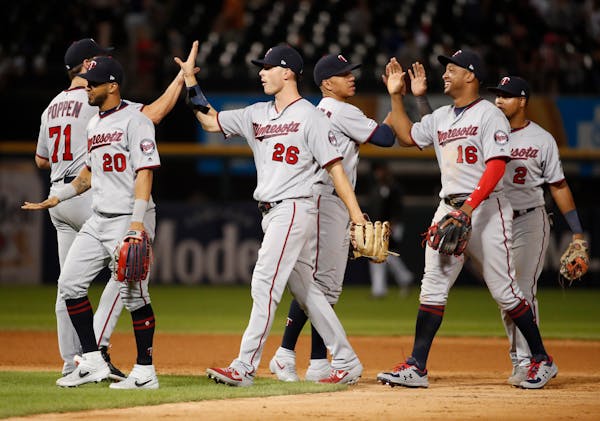The Twins celebrate after beating the Chicago White Sox 10-3 on Thursday.