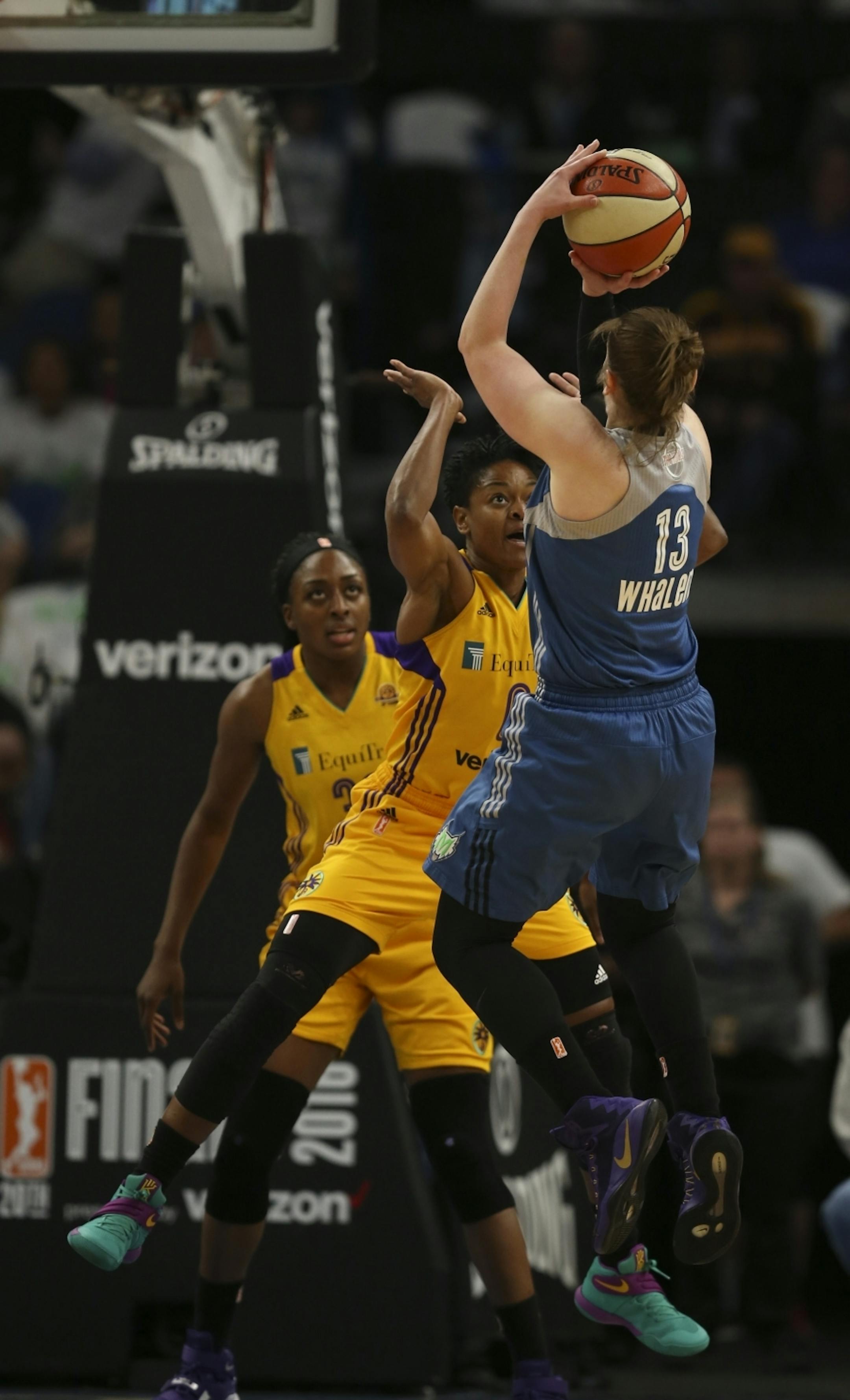 Minnesota Lynx guard Lindsay Whalen (13) shot over Los Angeles Sparks guard Alana Beard (0) in the first half.