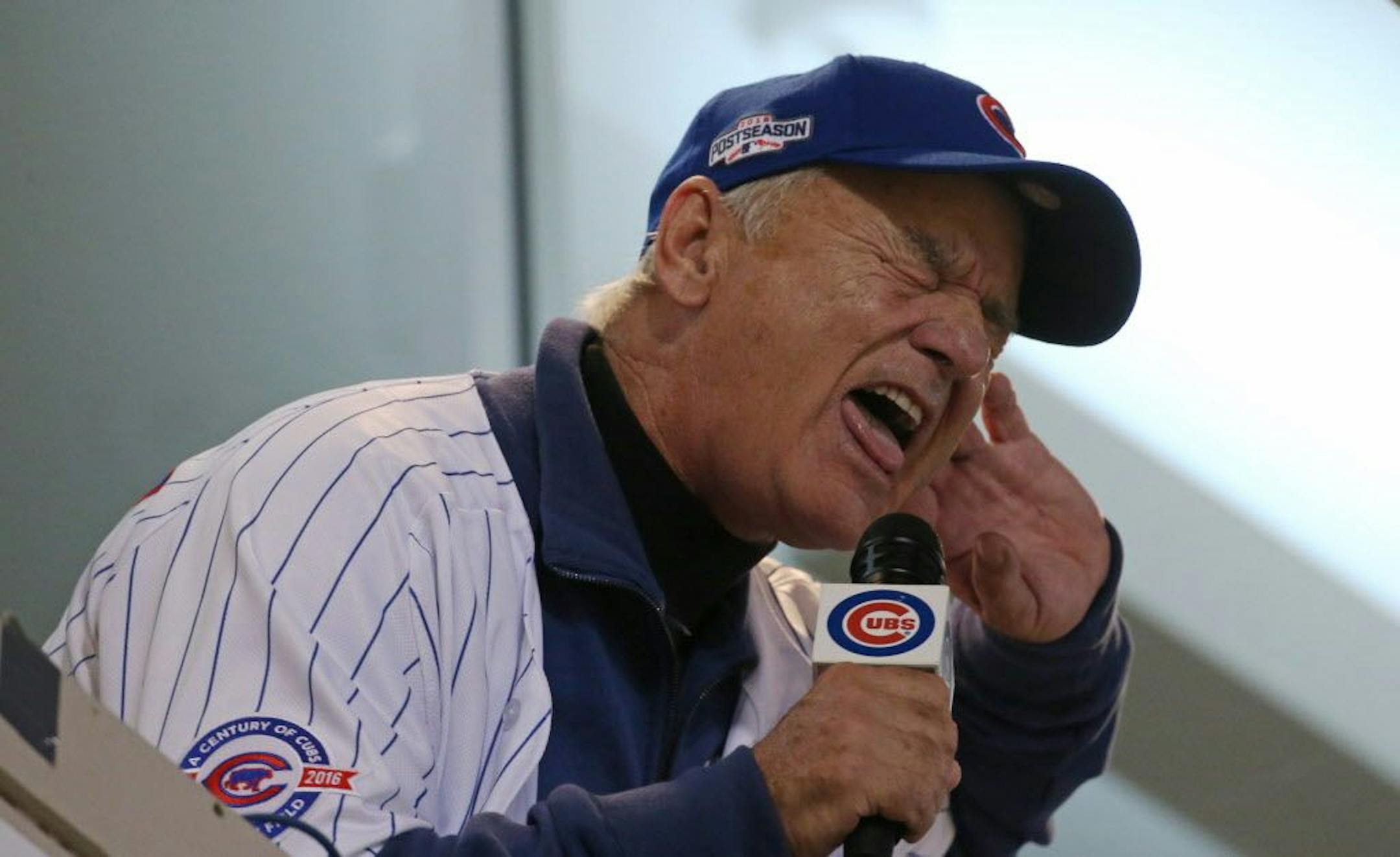 Actor Bill Murray sings "Take Me Out to the Ball Game" during Game 3 of the World Series between the Chicago Cubs and Cleveland Indians on Friday, Oct. 28, 2016, at Wrigley Field in Chicago.