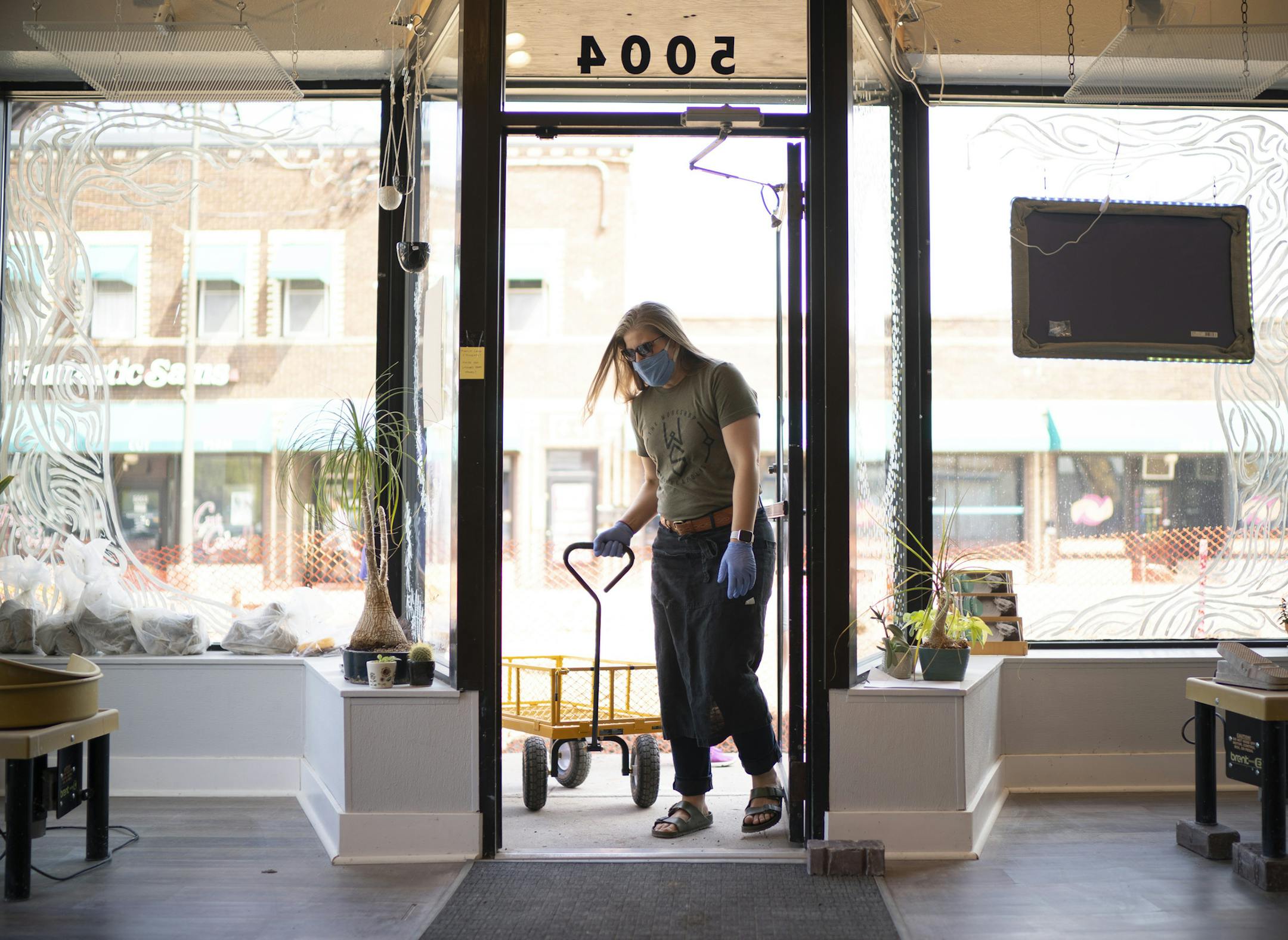 Jennie Tang returned with her hauling wagon after helping a customer with a load of clay to her car. ] JEFF WHEELER • Jeff.Wheeler@startribune.com When Minneapolis launched its forgivable loan program to help small businesses cope with the pandemic, it put in place criteria that made businesses in large swaths of the city ineligible. Jennie Tang, owner of The Workshop Minneapolis, a pottery studio in south Minneapolis applied for the program but later learned her business wasn't eligible