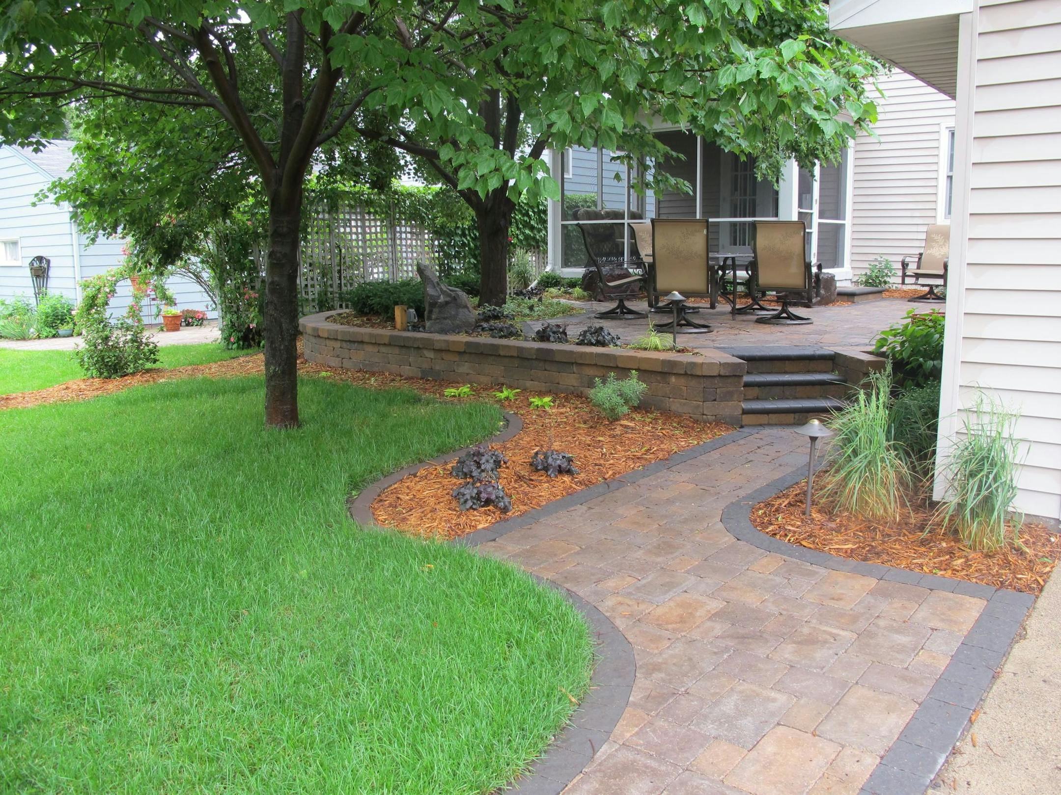 Before & After - Paver patio and walkway create outdoor living in a NE Mpls. yard, by Bachman's. Credit Bachman's Landscaping & Garden Services