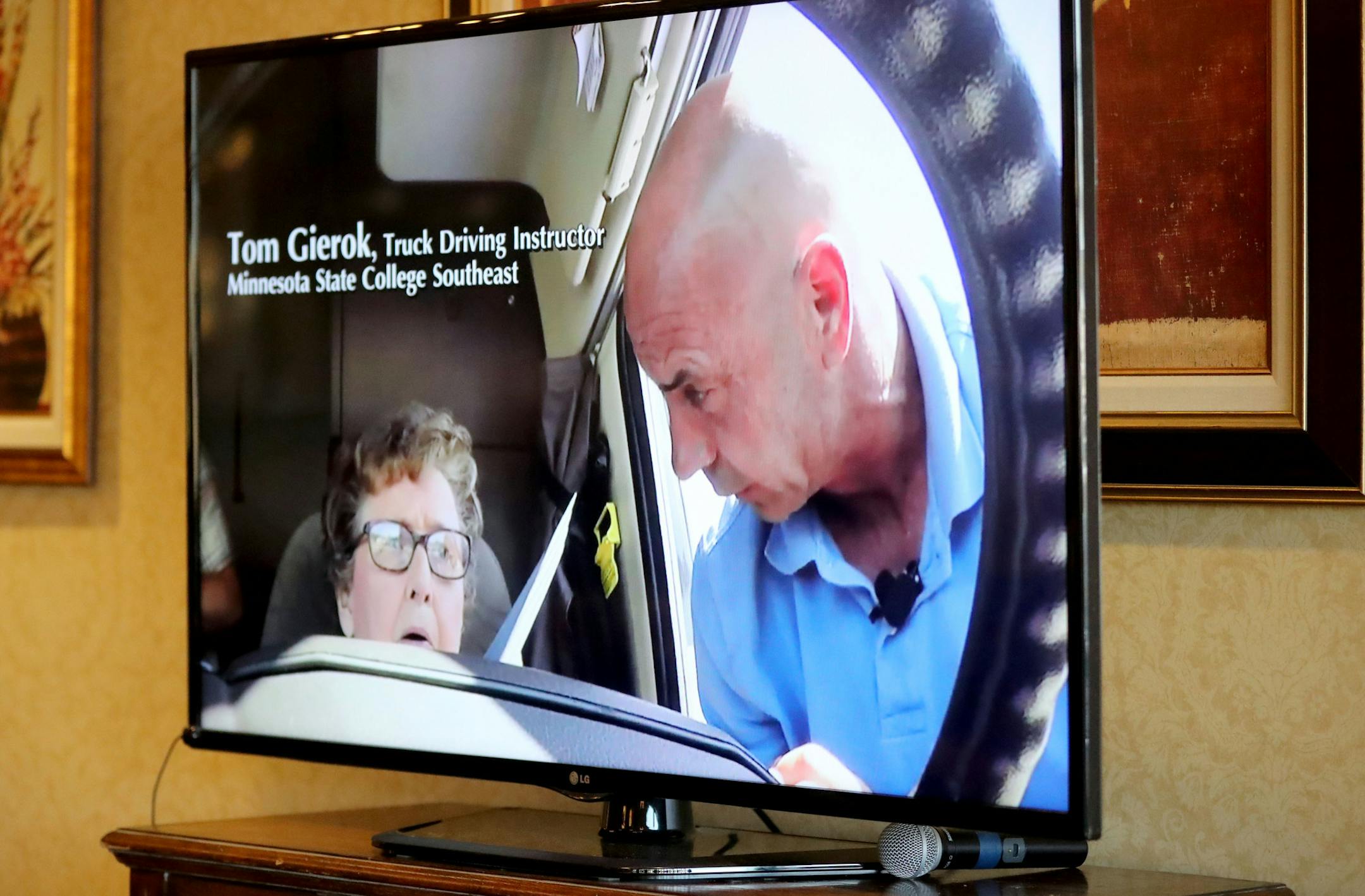 A screen showing a video of Spencer behind the wheel.