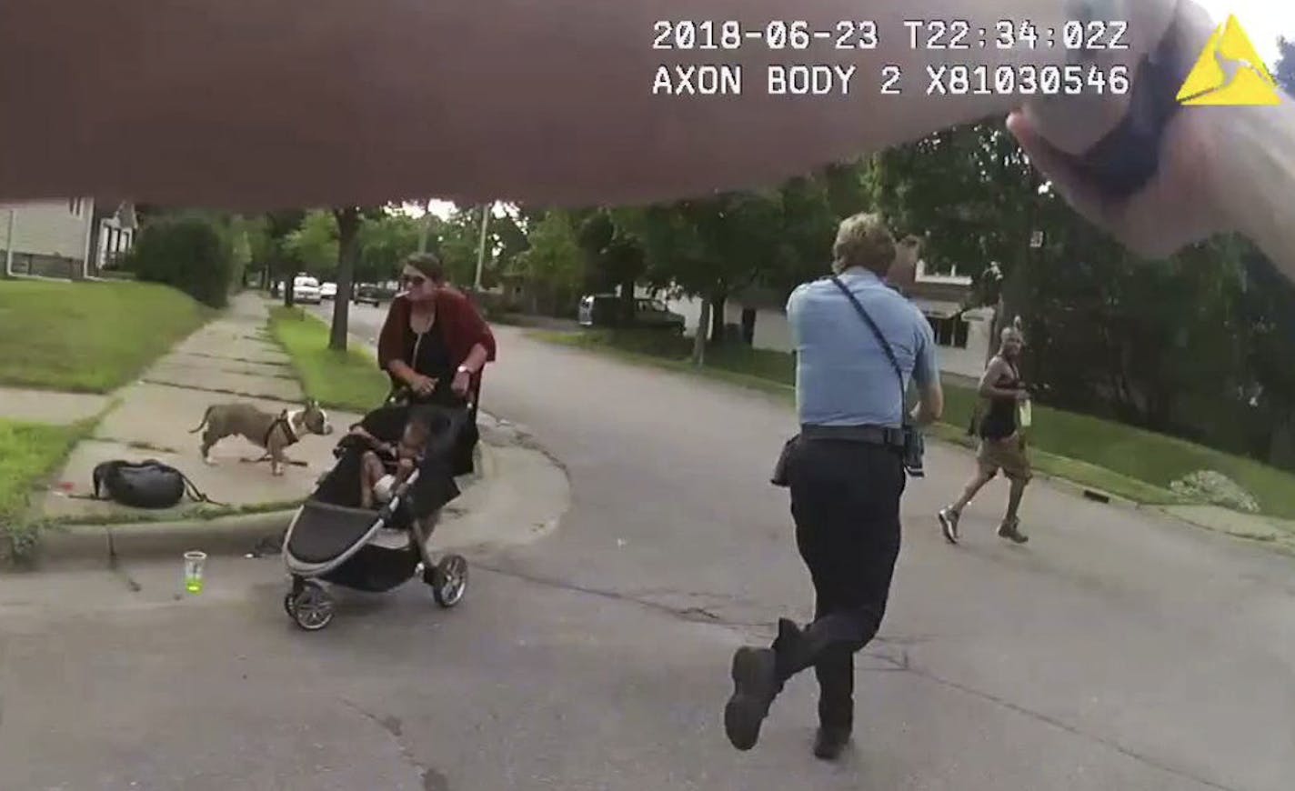 A still frame grab from the body cam worn by Officer Ryan Kelly showing Officer Justin Schmidt as the pursuit of Thurman Blevins began on June 23.