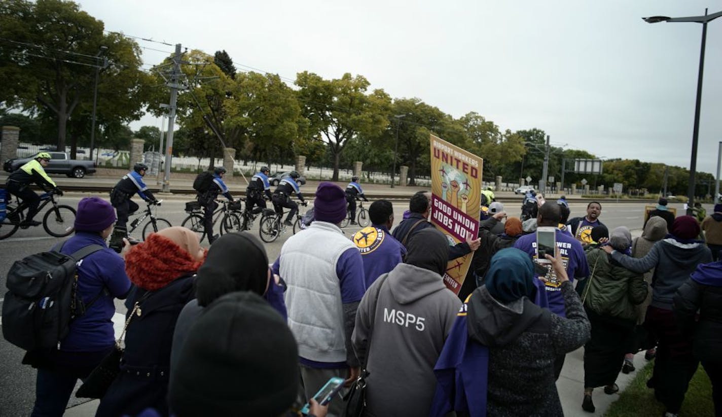 Several dozen protesters marched to Delta headquarters to protest the firing of seven Muslim workers who had been allegedly fired for praying while working for a Delta subcontractor.