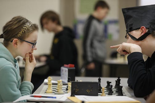 Audra Johnson, 14, plays a game with Will Moe,13. She lost out to a Texas player whose team was allegedly involved in a scheme to favor its class groupings.] The Burnsville Metcalf Junior High School chess team lost out on a national championship to a school from Texas which now has been found to have cheated in a scheme directed by the team's coach.RICHARD TSONG-TAATARII &#xa5; richard.tsong-taatarii@startribune.com