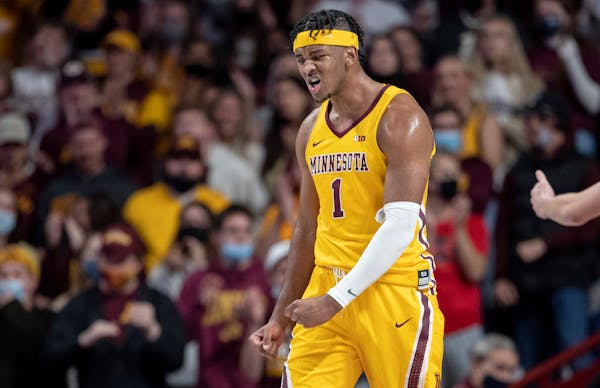 Eric Curry of Minnesota reacts after scoring in the first half Tuesday, Nov. 9, 2021.