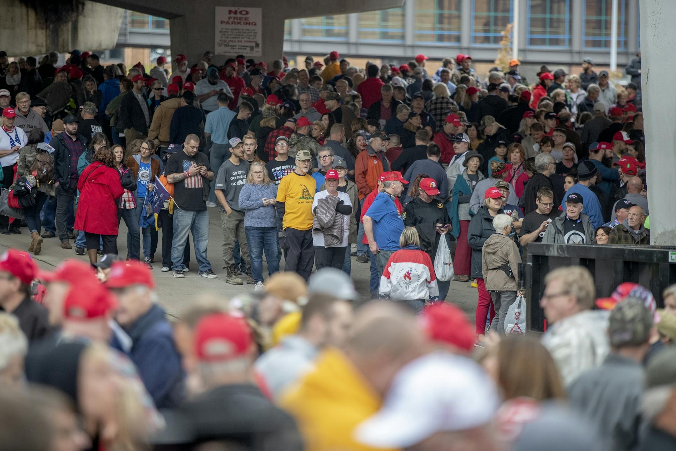 Trump supporters waited in the rain to get into the Target Center from 5th Street North, for President Trump's visit, Thursday, October 10, 2019 in Minneapolis, MN.