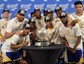 The Golden State Warriors pose for a photograph with the NBA Western Conference Final trophy after winning Game 4 of the NBA Western Conference Finals