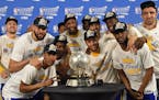 The Golden State Warriors pose for a photograph with the NBA Western Conference Final trophy after winning Game 4 of the NBA Western Conference Finals