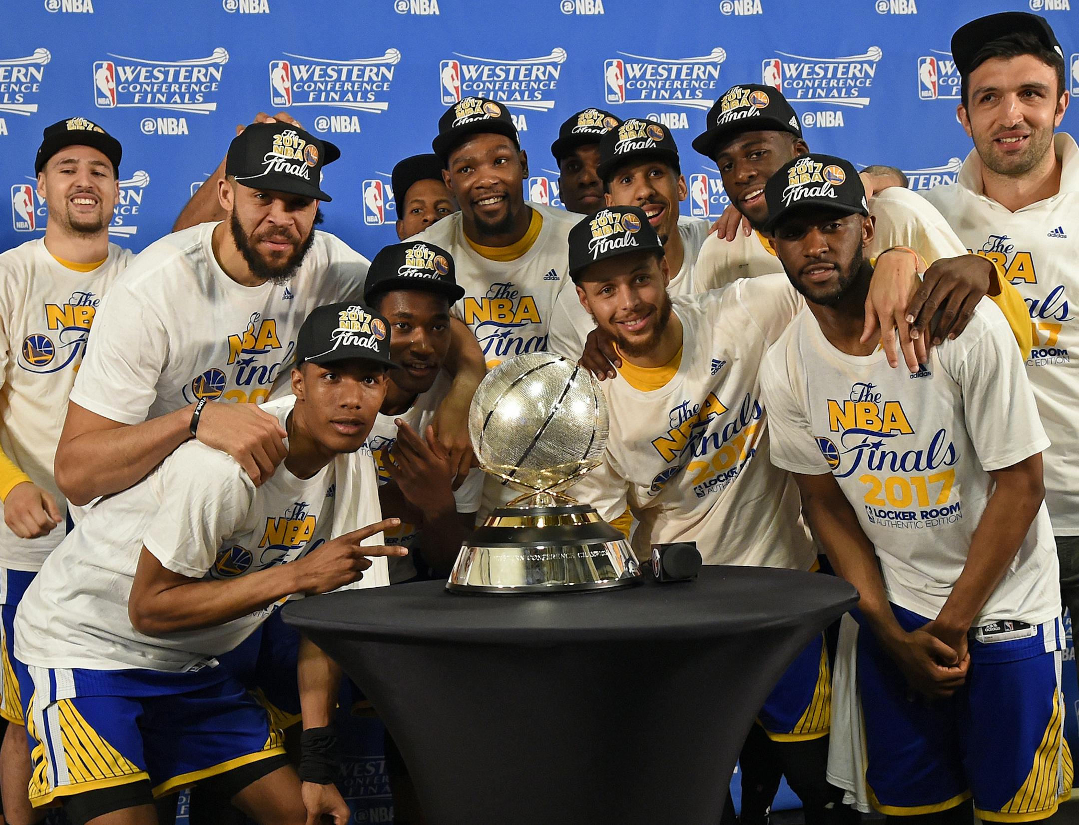 The Golden State Warriors pose for a photograph with the NBA Western Conference Final trophy after winning Game 4 of the NBA Western Conference Finals at AT&T Center in San Antonio, Texas, on Monday, May 22, 2017. Golden State Warriors defeat the San Antonio Spurs 129-115 to win the NBA Western Conference Final. (Jose Carlos Fajardo/Bay Area News Group/TNS)