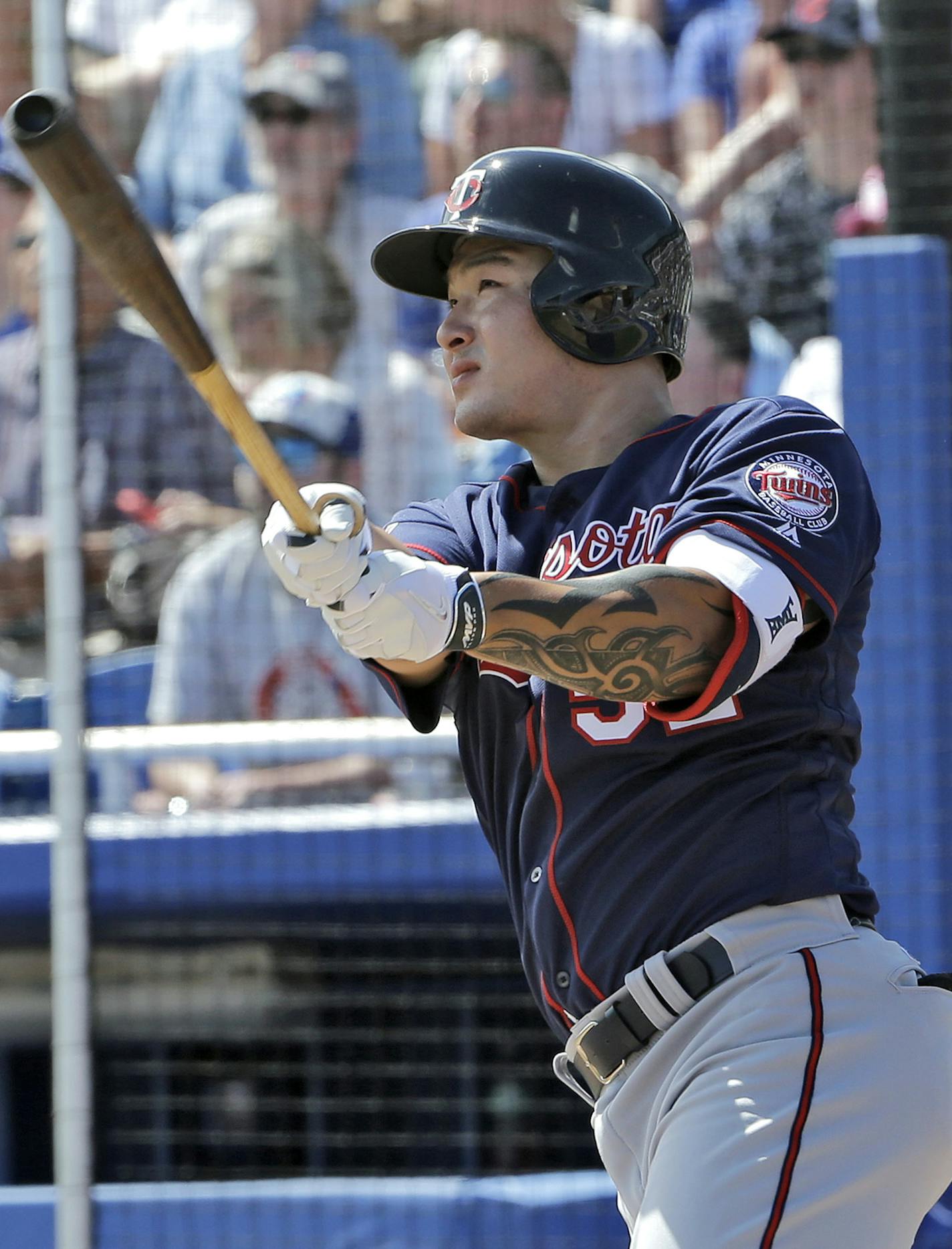 Minnesota Twins' Byung Ho Park, of South Korea, follows the flight of his home run off Toronto Blue Jays starting pitcher Gavin Floyd during the second inning of a spring training baseball game Tuesday, March 8, 2016, in Dunedin, Fla. (AP Photo/Chris O'Meara) ORG XMIT: FLCO114