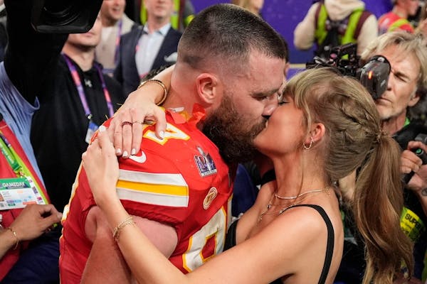 Kansas City Chiefs tight end Travis Kelce (87) kisses Taylor Swift after the NFL Super Bowl 58 football game against the San Francisco 49ers, Sunday, 