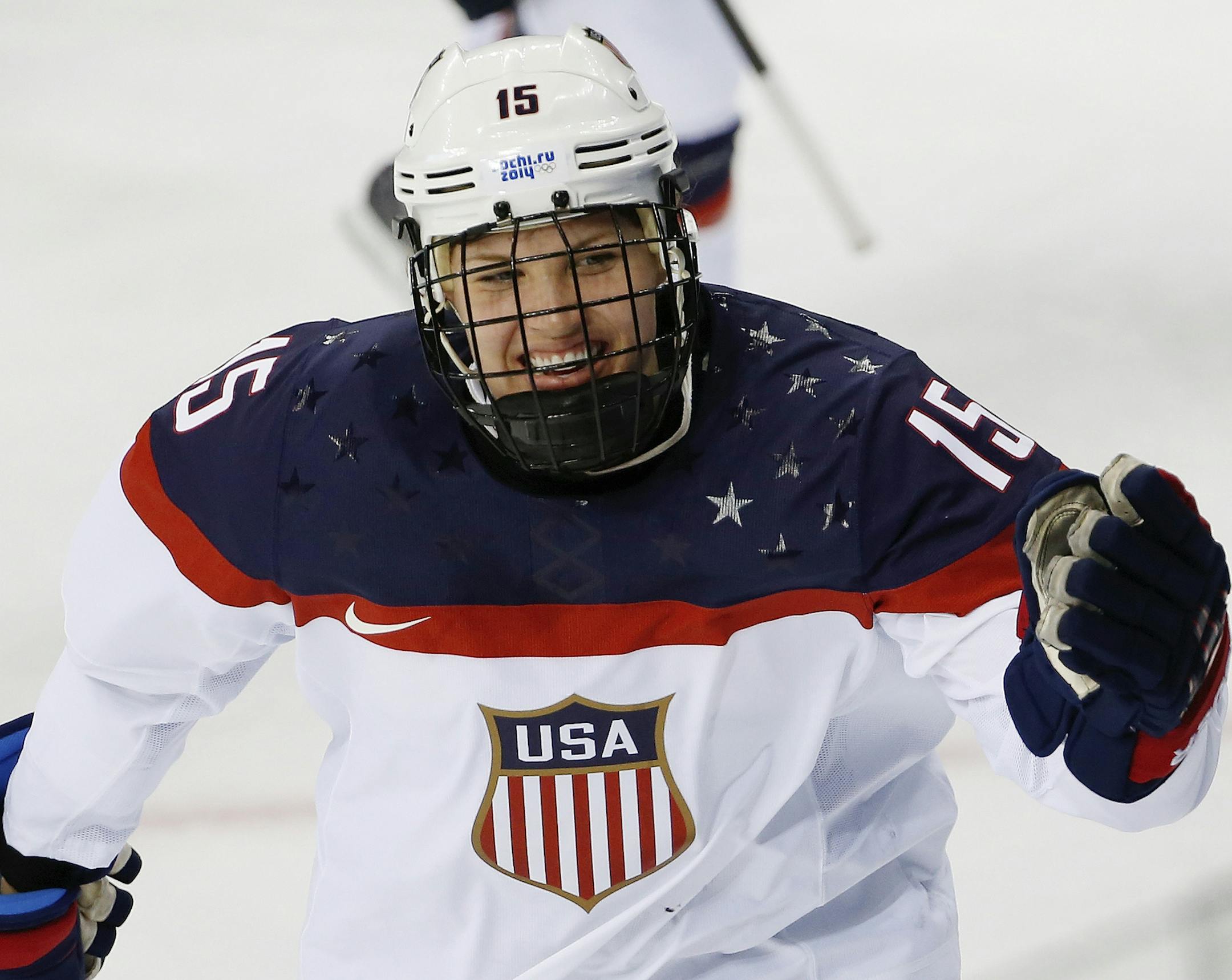 Anne Schleper of the United States celebrates a goal against Canada during the second period of the 2014 Winter Olympics women's ice hockey game at Shayba Arena, Wednesday, Feb. 12, 2014, in Sochi, Russia. (AP Photo/Petr David Josek)