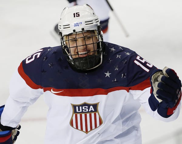 Anne Schleper of the United States celebrates a goal against Canada during the second period of the 2014 Winter Olympics women's ice hockey game at Sh