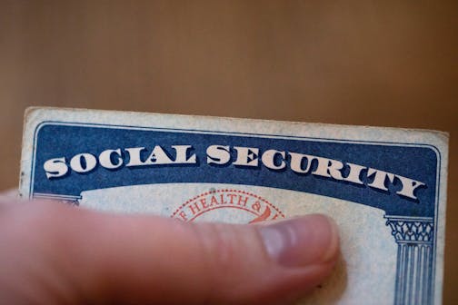 FILE - A Social Security card is displayed on Oct. 12, 2021, in Tigard, Ore. About 71 million people including retirees, disabled people and children receive Social Security benefits. (AP Photo/Jenny Kane, File)