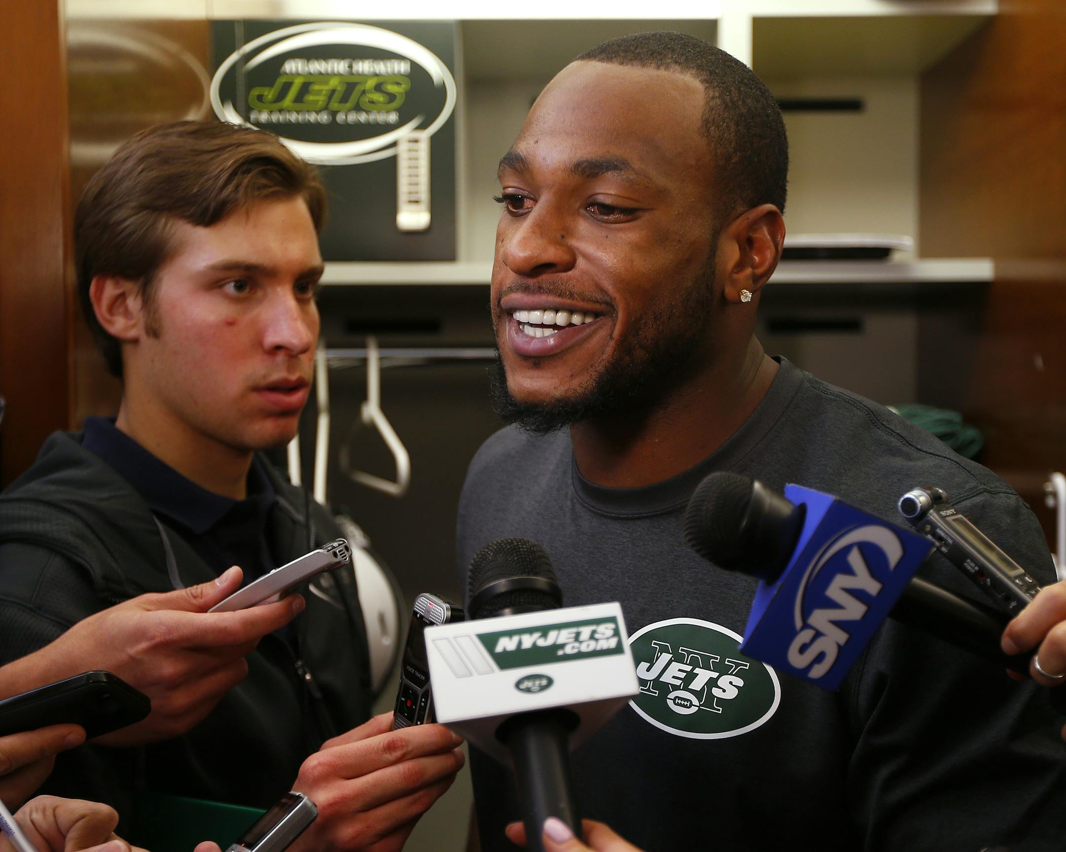 New York Jets NFL football wide receiver Percy Harvin (16) talks to the media at his locker after his first practice since his trade from Seattle in Florham Park, N.J., Monday, Oct. 20, 2014. (AP Photo/Rich Schultz)