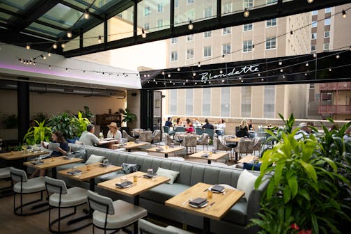 The open-air dining area of Blondette, the latest of Daniel del Prado's restaurants on the 5th floor of the Rand Tower. photographed Tuesday evening, May 16, 2023 in Minneapolis.   ]  JEFF WHEELER • jeff.wheeler@startribune.com