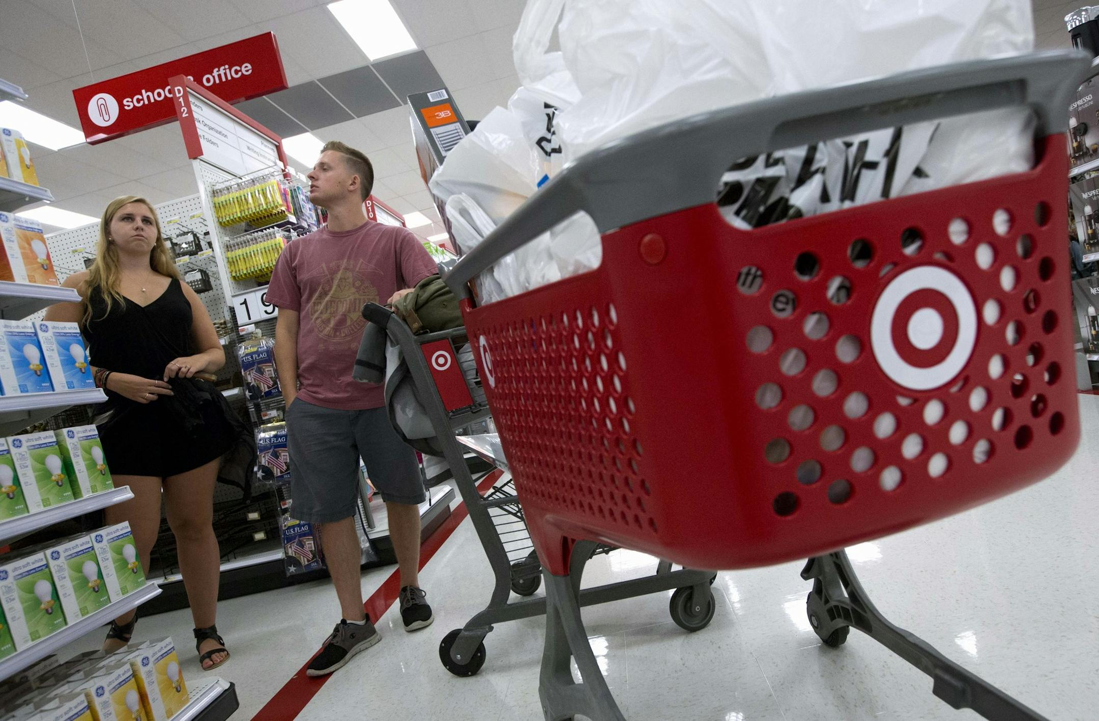In this Aug. 21, 2015, photo, Boston College students Alli Urbon, left, and Eddie Dols shop at the CityTarget store in Boston. The Commerce Department releases retail sales data for September on Wednesday, Oct. 14, 2015. (AP Photo/Michael Dwyer)